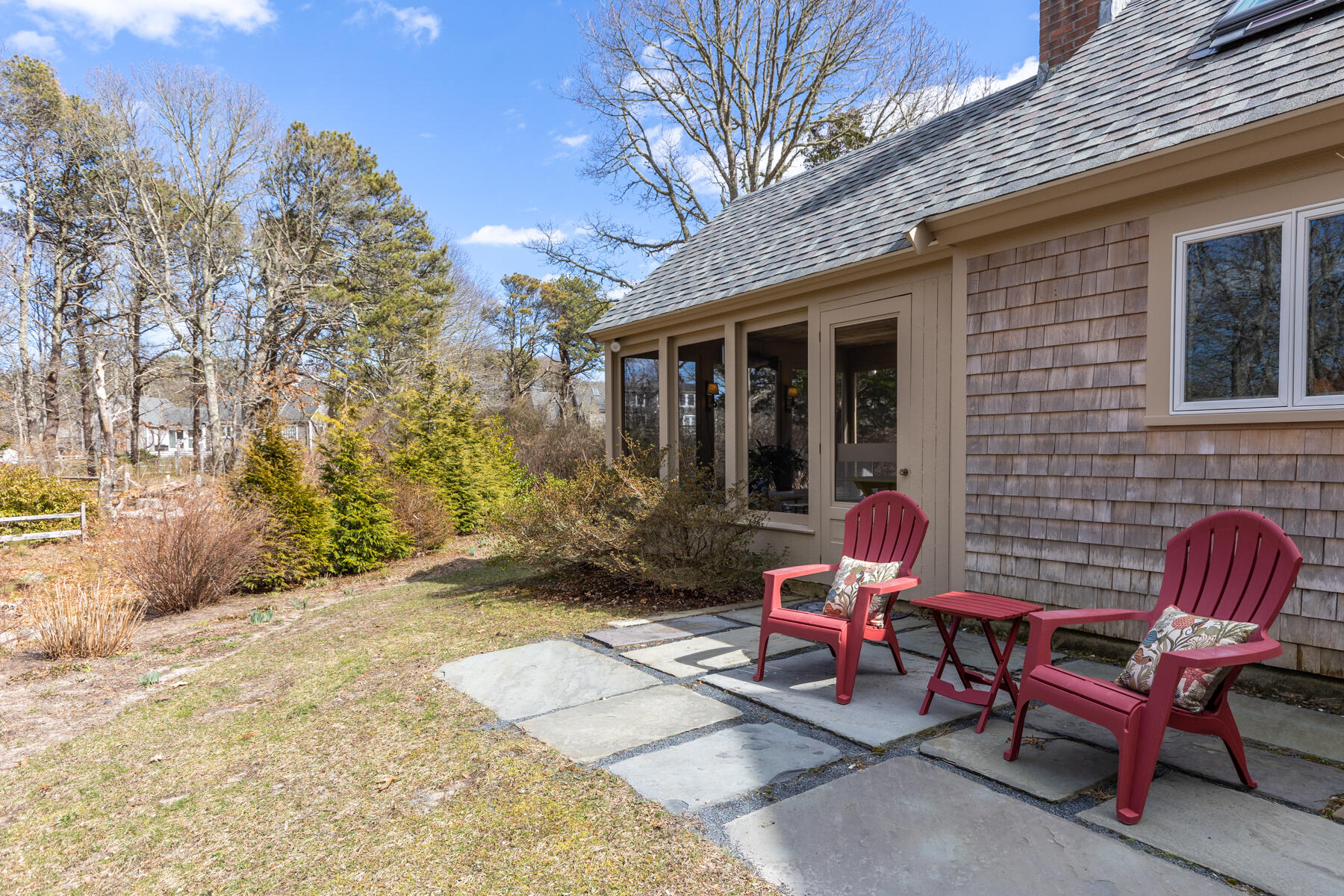 84 Beach Road Orleans, MA 02653 - Photo 28 of 45 a view of a backyard with table and chairs and a barbeque