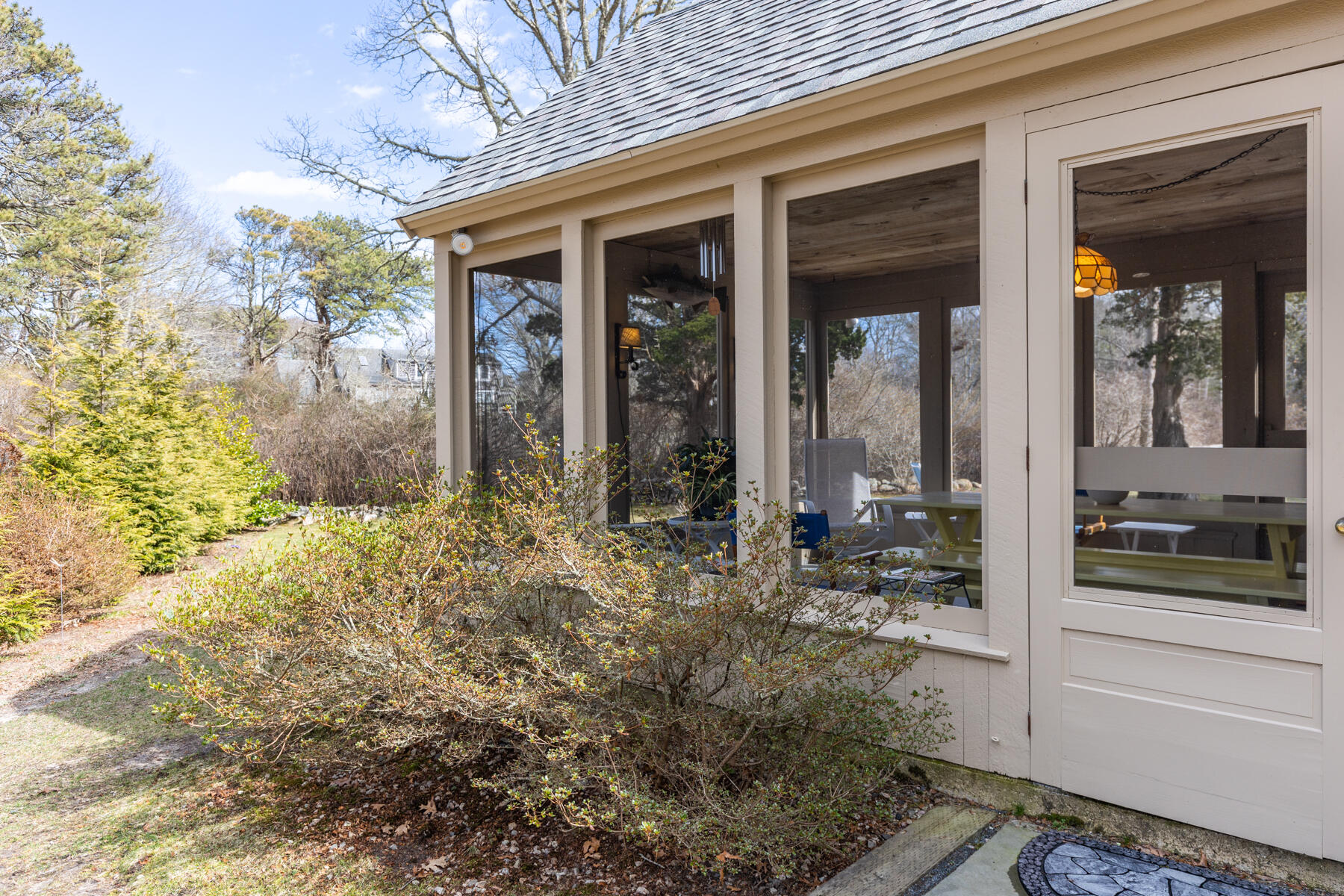 84 Beach Road Orleans, MA 02653 - Photo 29 of 45 a front view of a house with garden