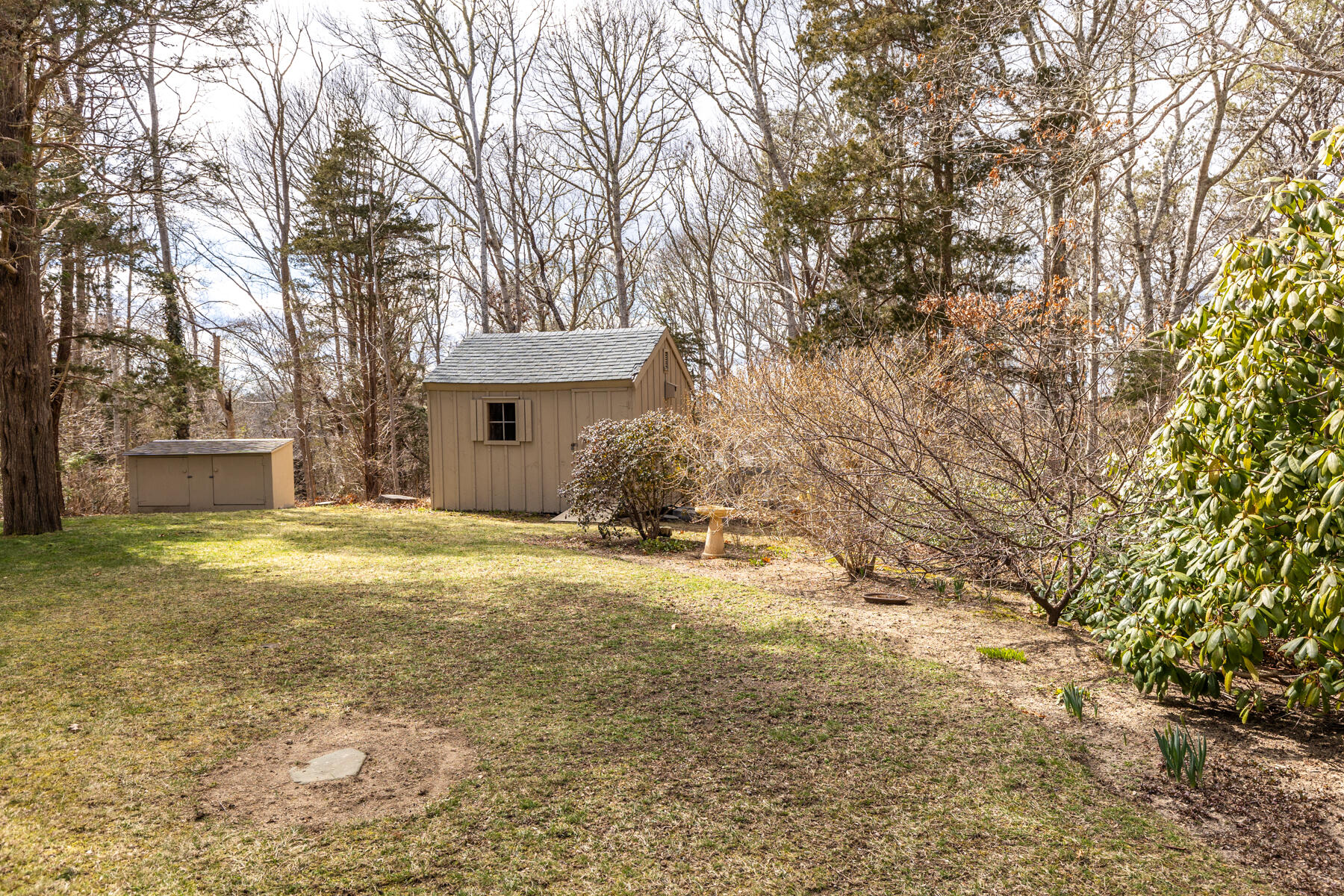 84 Beach Road Orleans, MA 02653 - Photo 30 of 45 a view of a house with a yard and garage