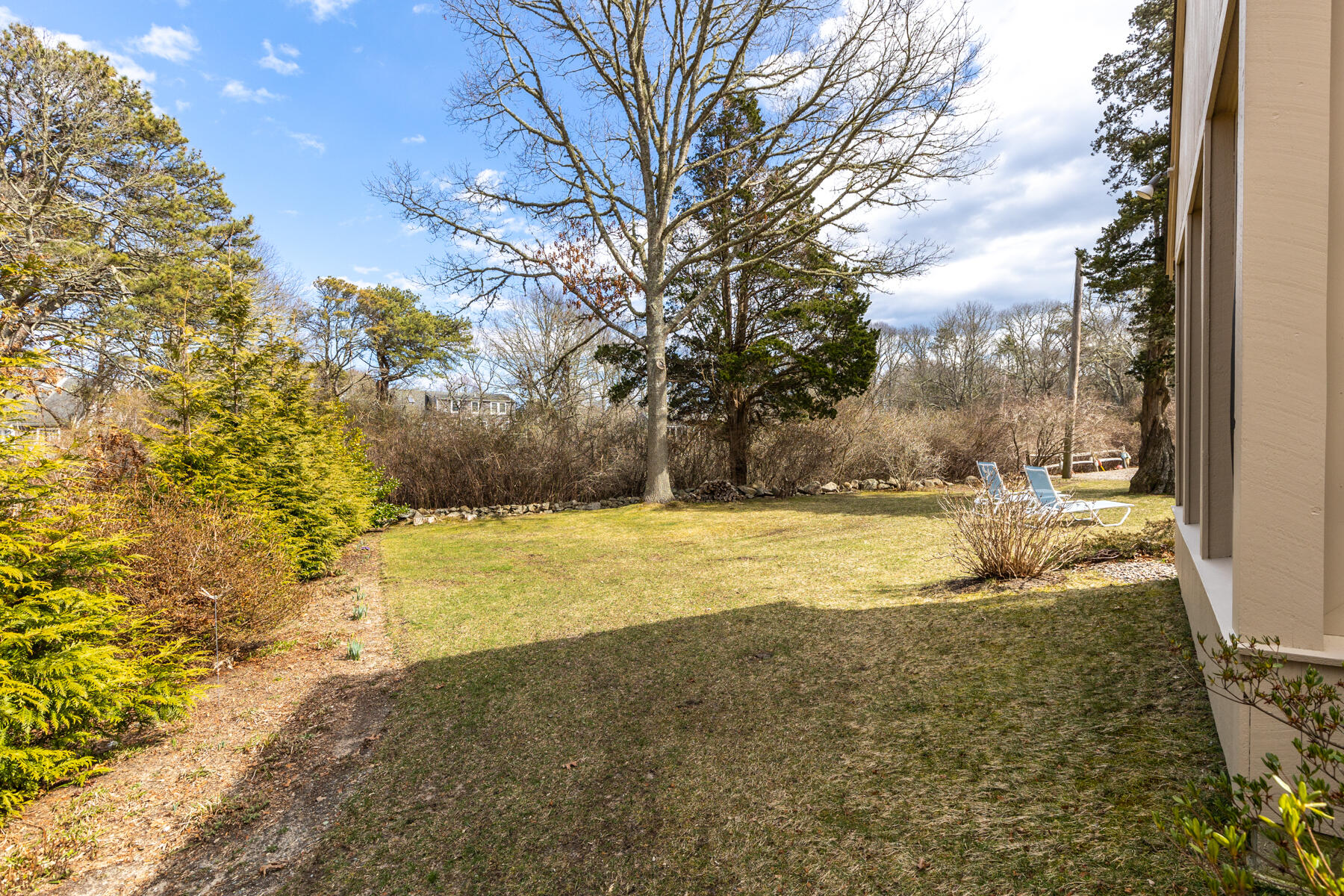 84 Beach Road Orleans, MA 02653 - Photo 31 of 45 a view of an outdoor space and a yard
