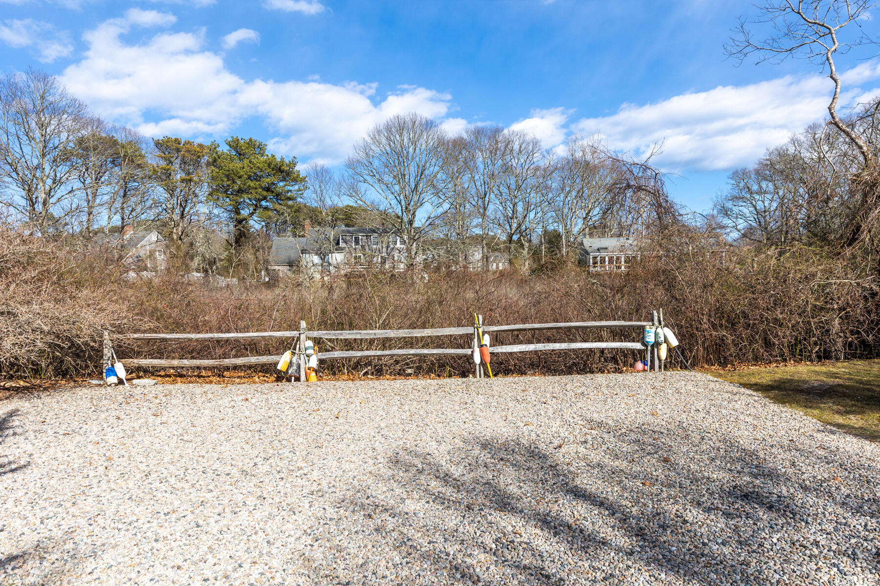 84 Beach Road Orleans, MA 02653 - Photo 34 of 45 a view of a yard with wooden fence