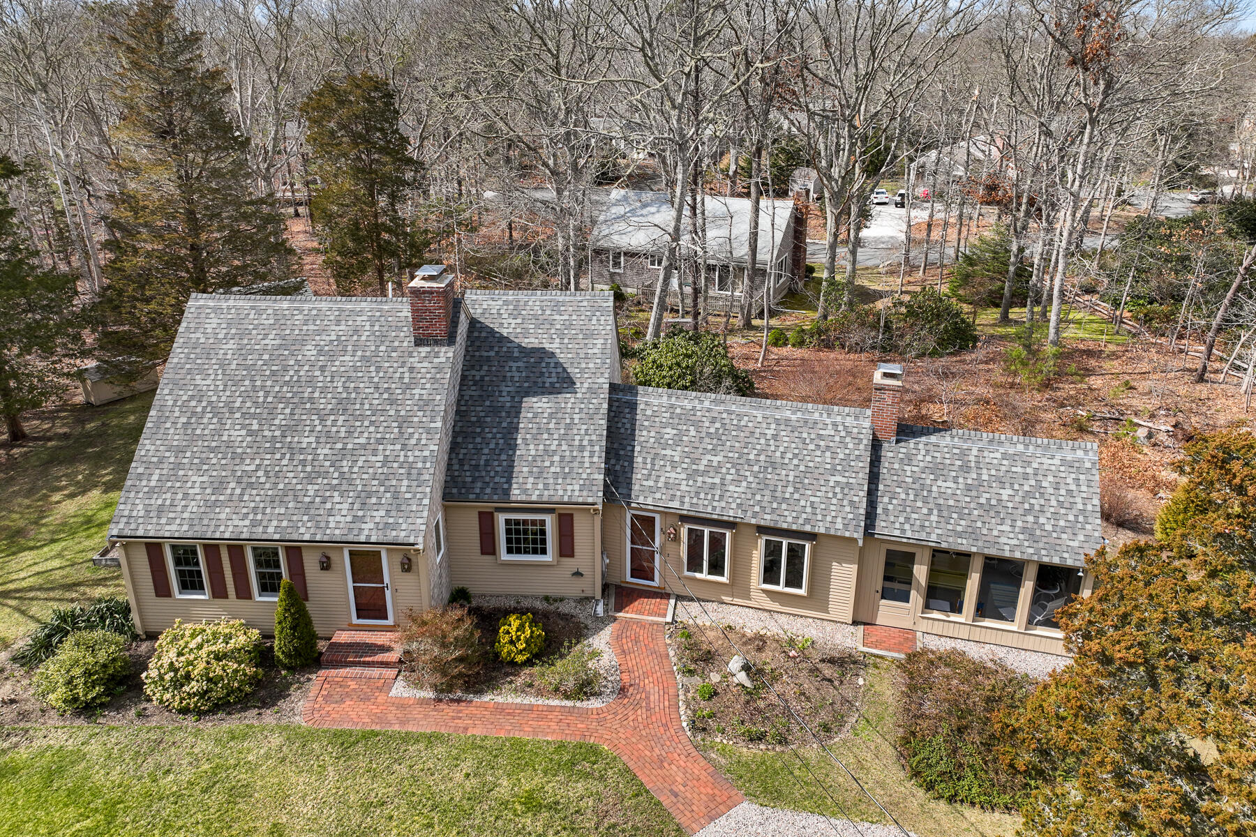 84 Beach Road Orleans, MA 02653 - Photo 4 of 45 front view of a house with a yard