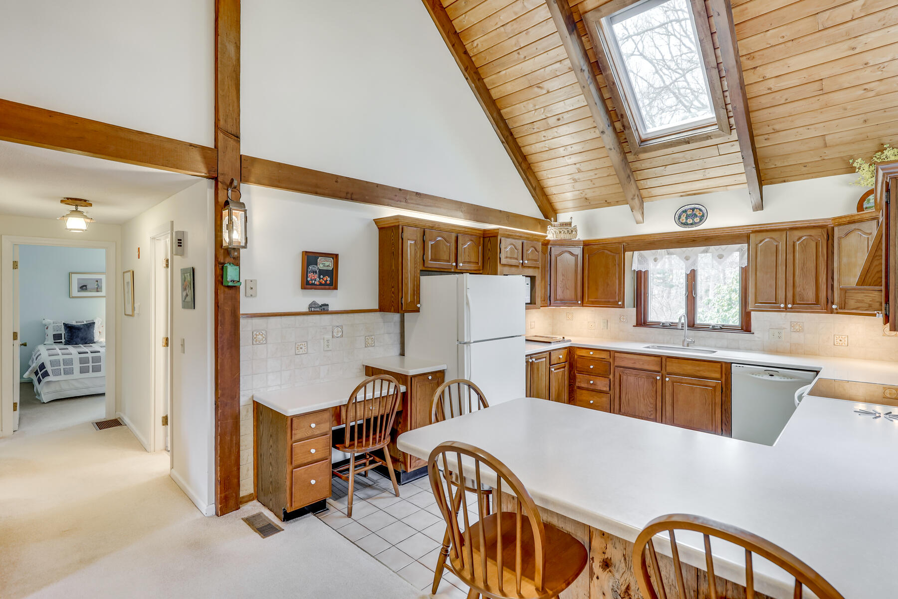 84 Beach Road Orleans, MA 02653 - Photo 9 of 45 a living room with stainless steel appliances kitchen island granite countertop furniture and a kitchen view