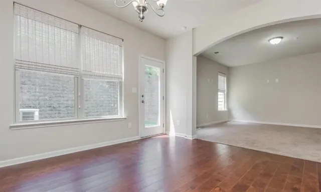 a kitchen with granite countertop wooden cabinets and stainless steel appliances