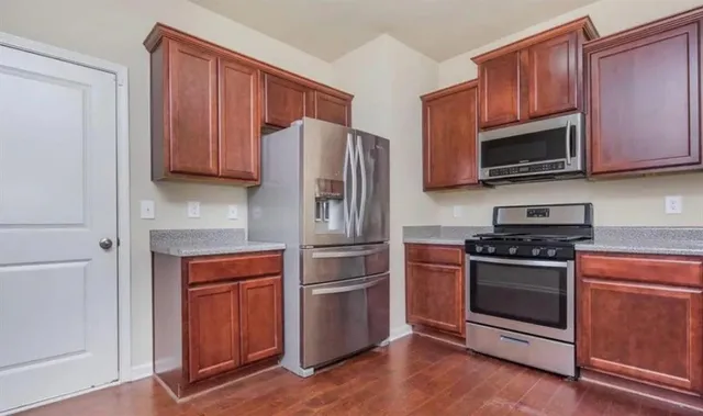 a view of a kitchen from the hallway