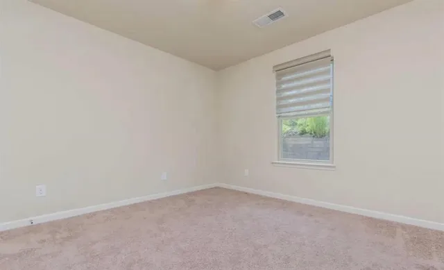 an aerial view of multiple houses with yard