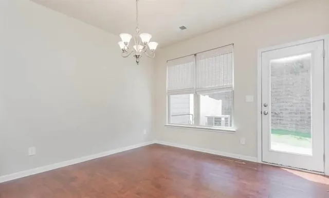 a view of a kitchen with a sink cabinet and a window