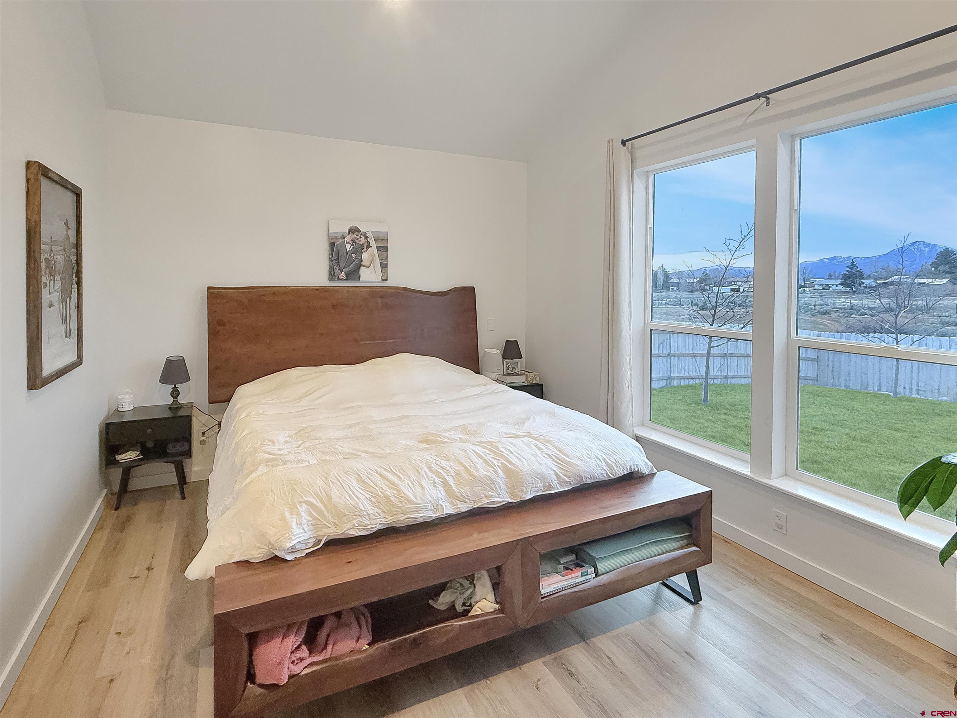 903 South Oak Street Cortez, CO 81321 - Photo 19 of 44 a bed sitting in a bedroom next to a window