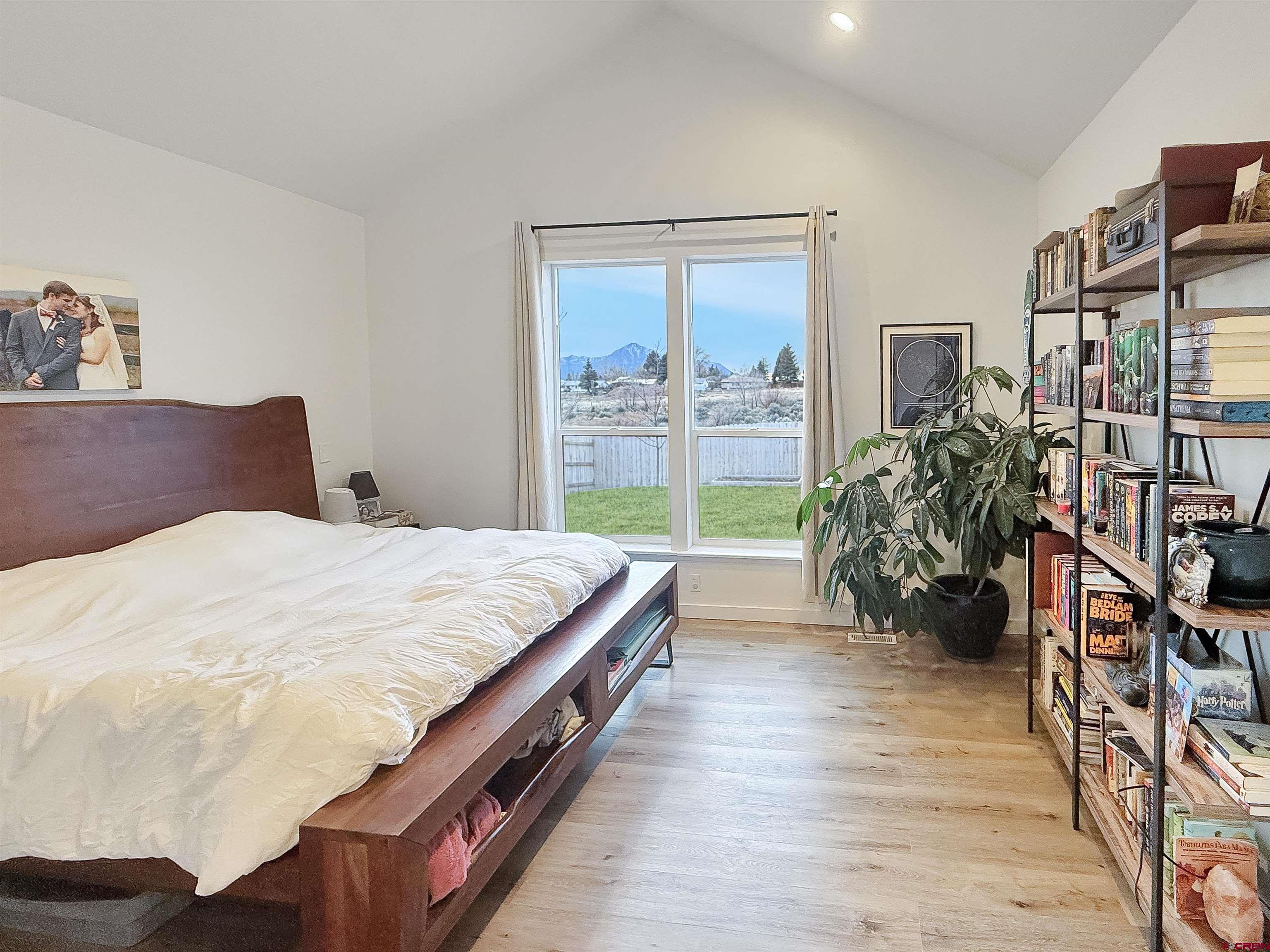 903 South Oak Street Cortez, CO 81321 - Photo 20 of 44 a bed sitting in a bedroom next to a window