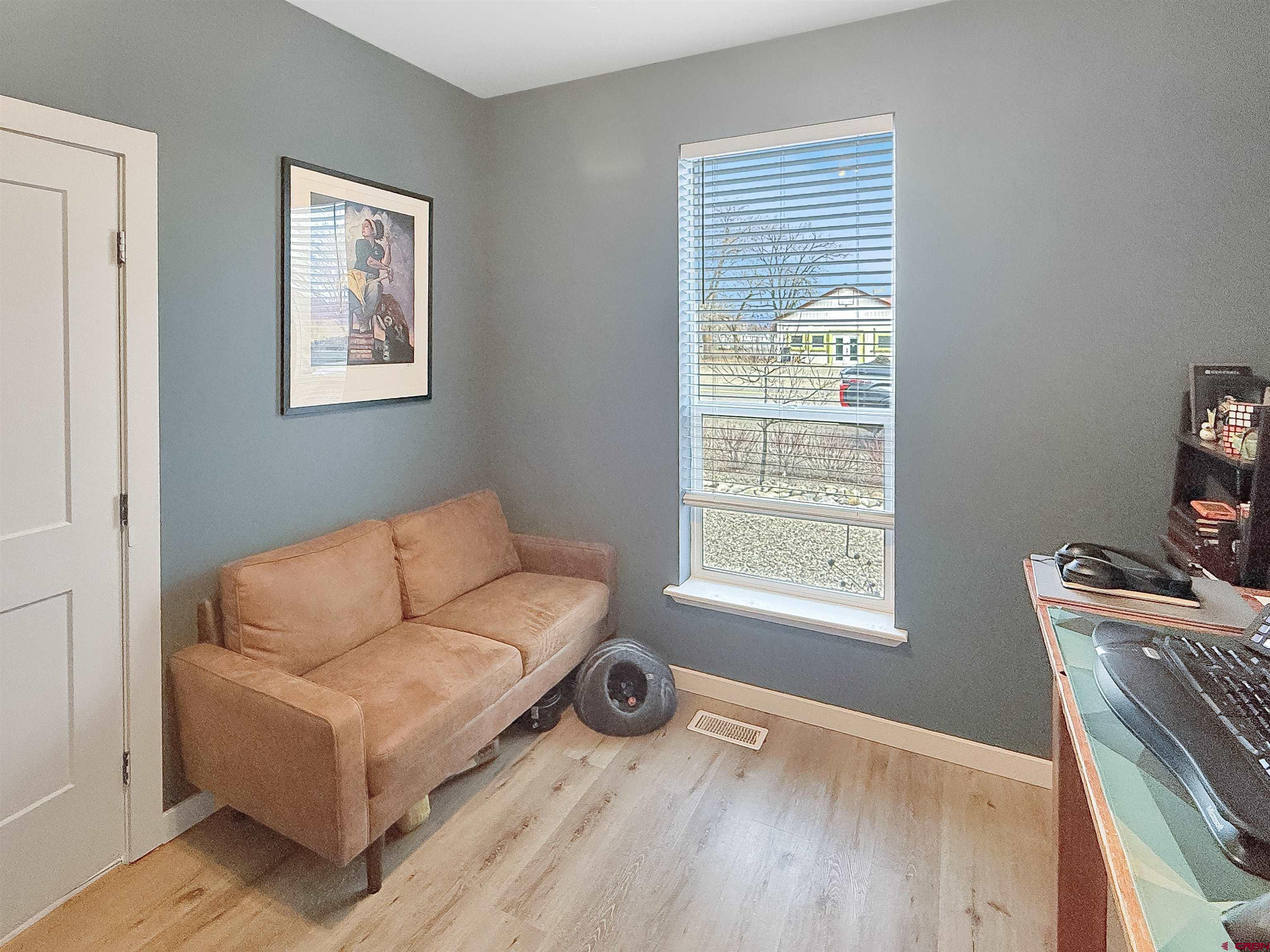 903 South Oak Street Cortez, CO 81321 - Photo 25 of 44 a living room with furniture and a window