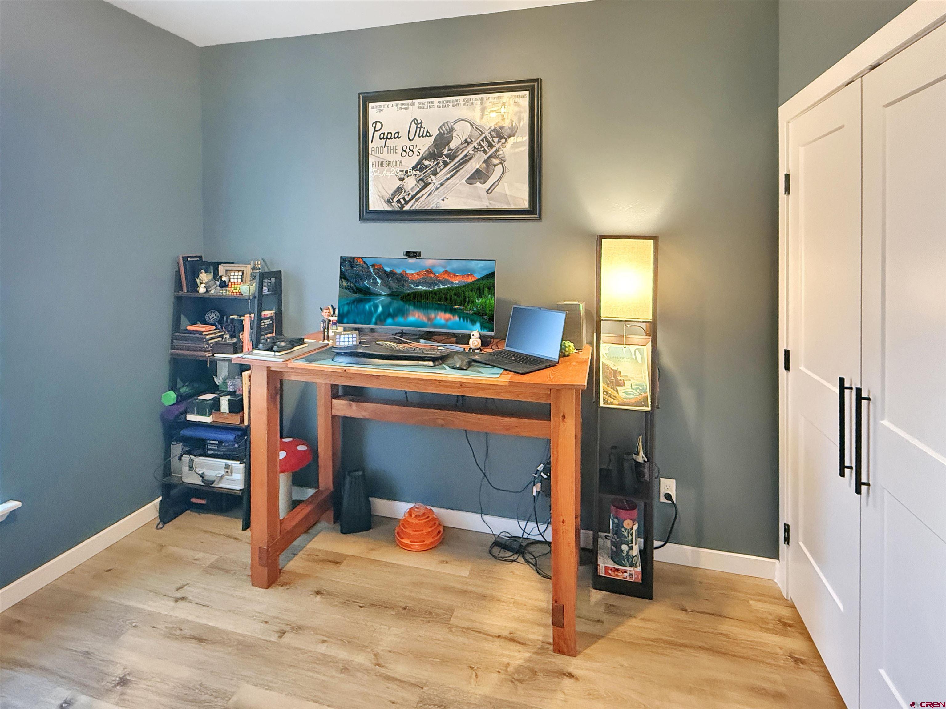 903 South Oak Street Cortez, CO 81321 - Photo 26 of 44 a room with furniture and a wooden floor