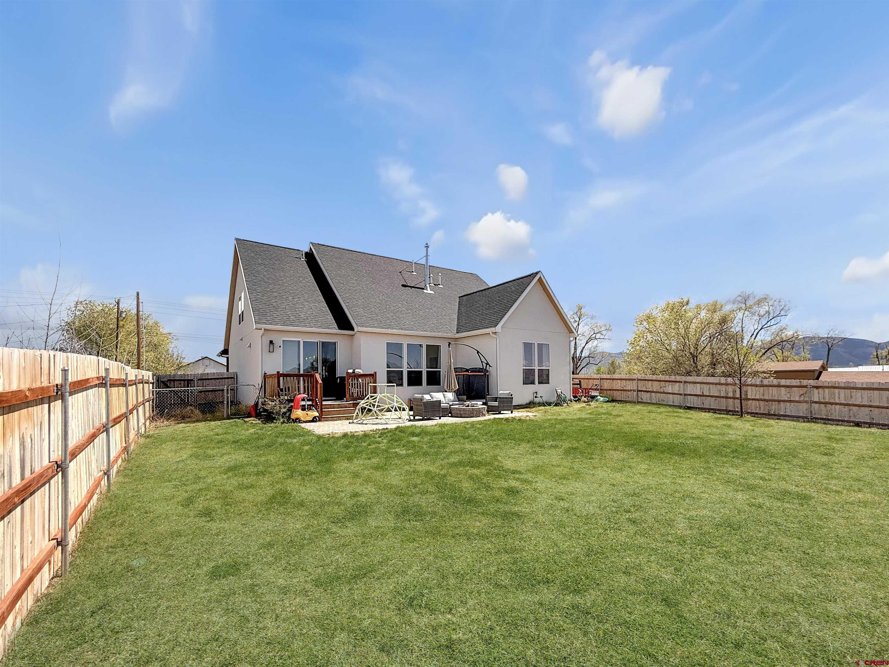 903 South Oak Street Cortez, CO 81321 - Photo 3 of 44 a view of a house with backyard and porch