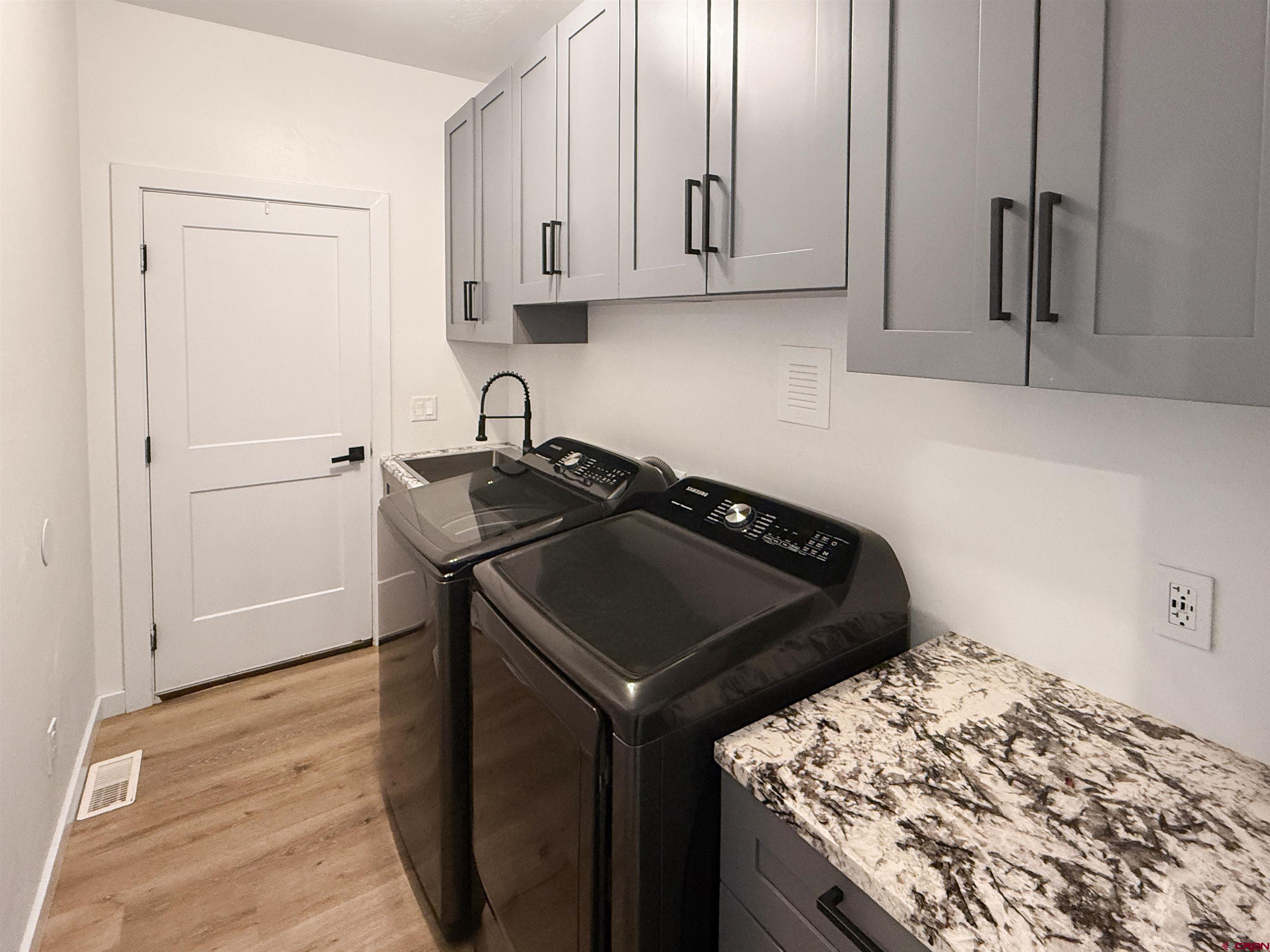 903 South Oak Street Cortez, CO 81321 - Photo 35 of 44 a kitchen with a sink stove and refrigerator