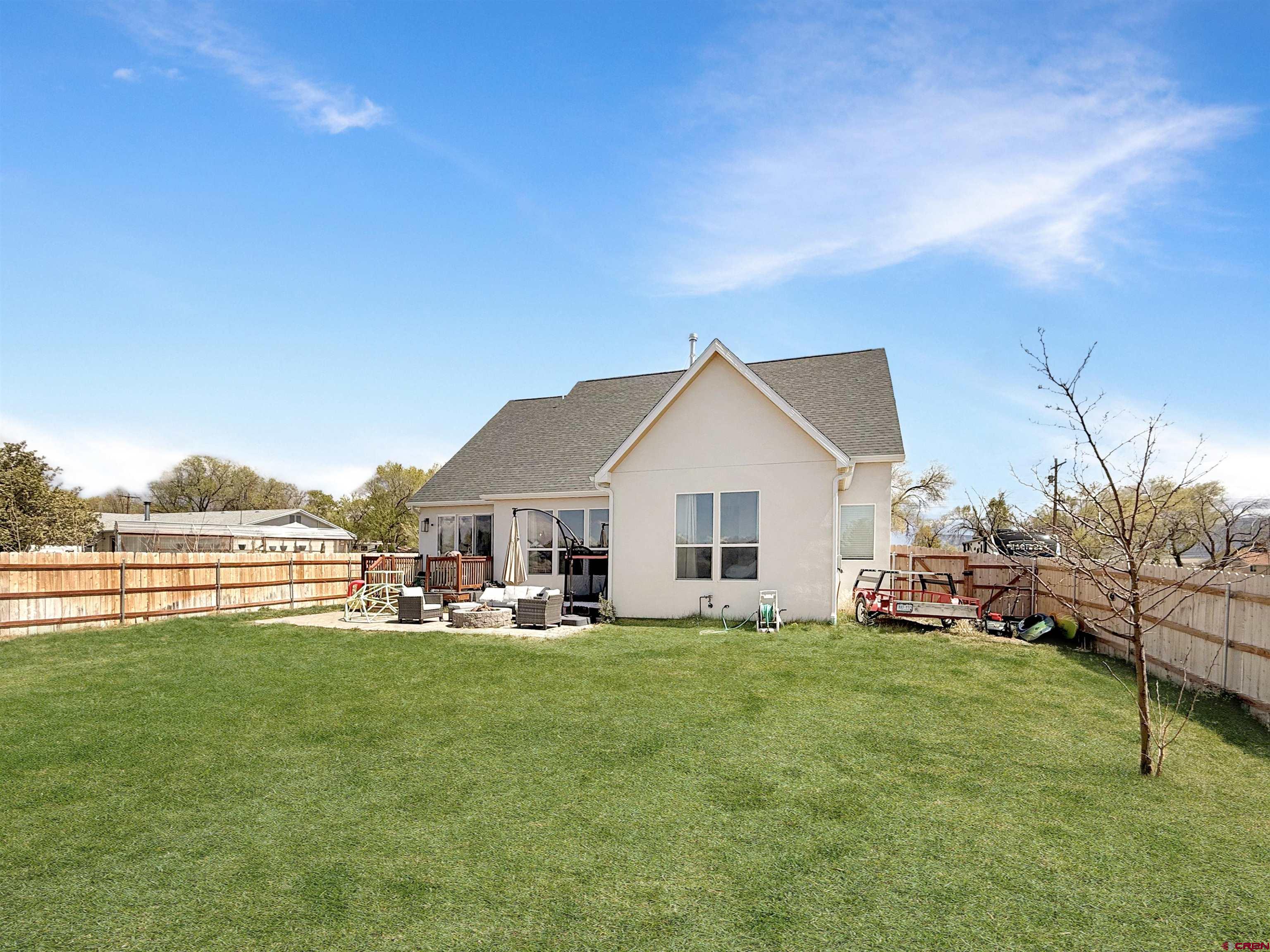 903 South Oak Street Cortez, CO 81321 - Photo 36 of 44 a view of a house with a yard and sitting area