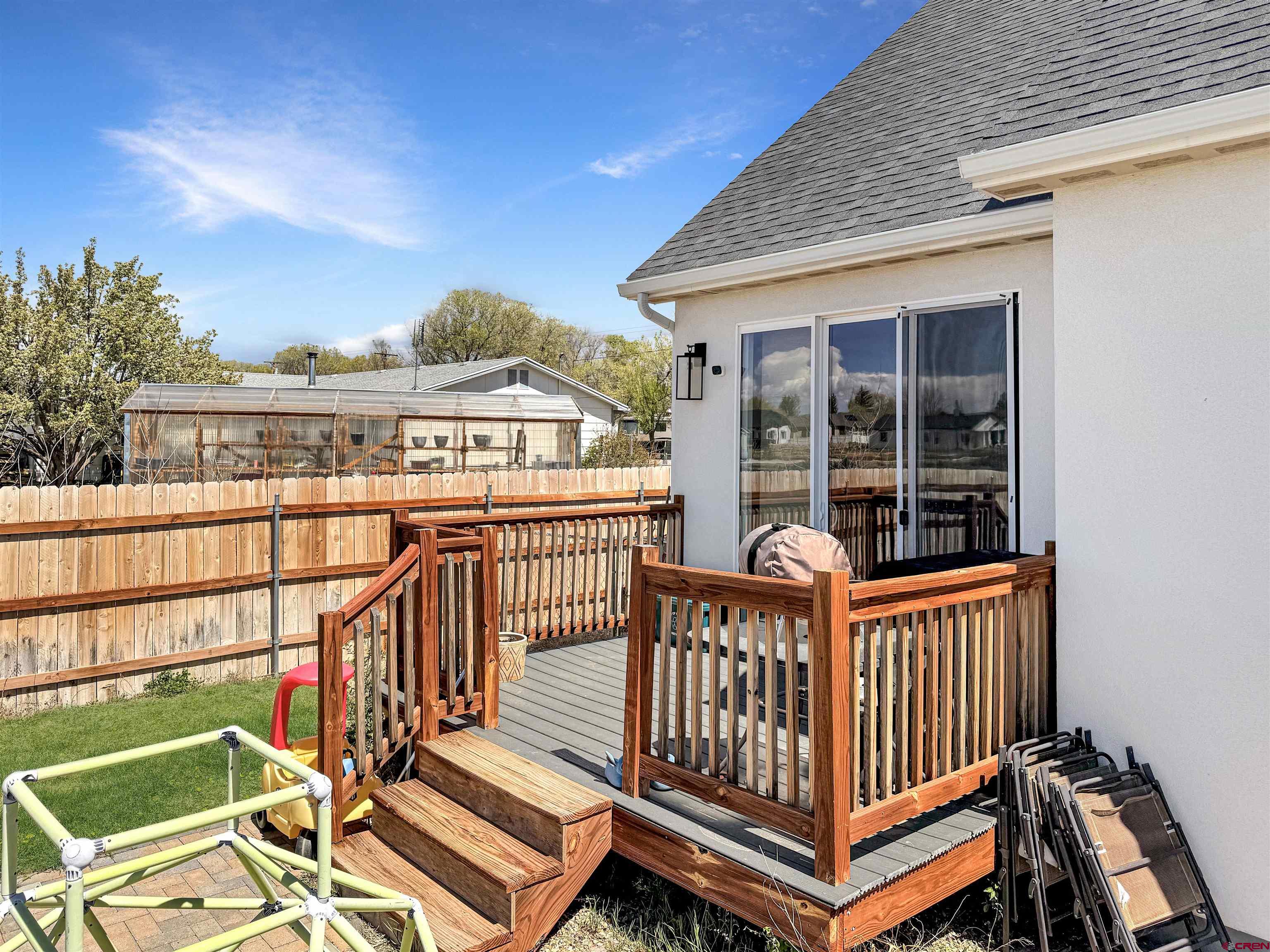 903 South Oak Street Cortez, CO 81321 - Photo 38 of 44 a view of a roof deck with wooden fence and wooden floor
