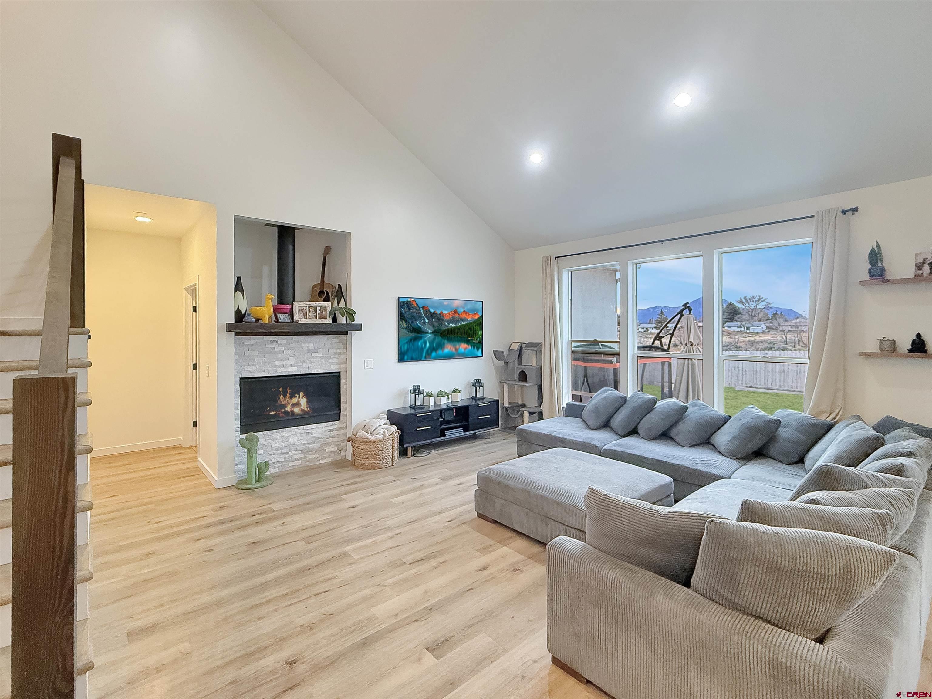 903 South Oak Street Cortez, CO 81321 - Photo 5 of 44 a living room with furniture and a fireplace
