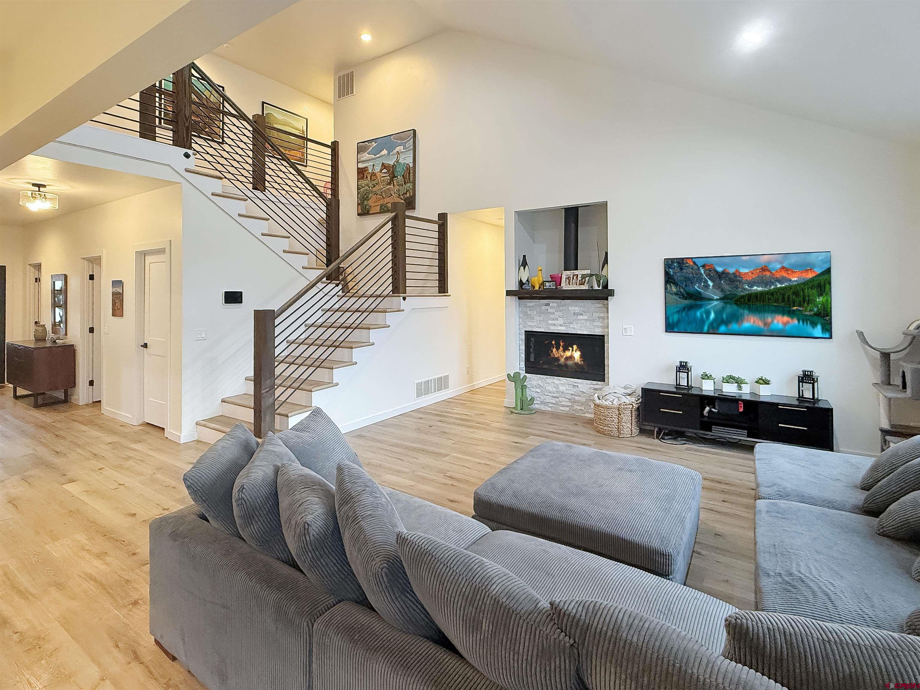 903 South Oak Street Cortez, CO 81321 - Photo 6 of 44 a living room with furniture and a flat screen tv
