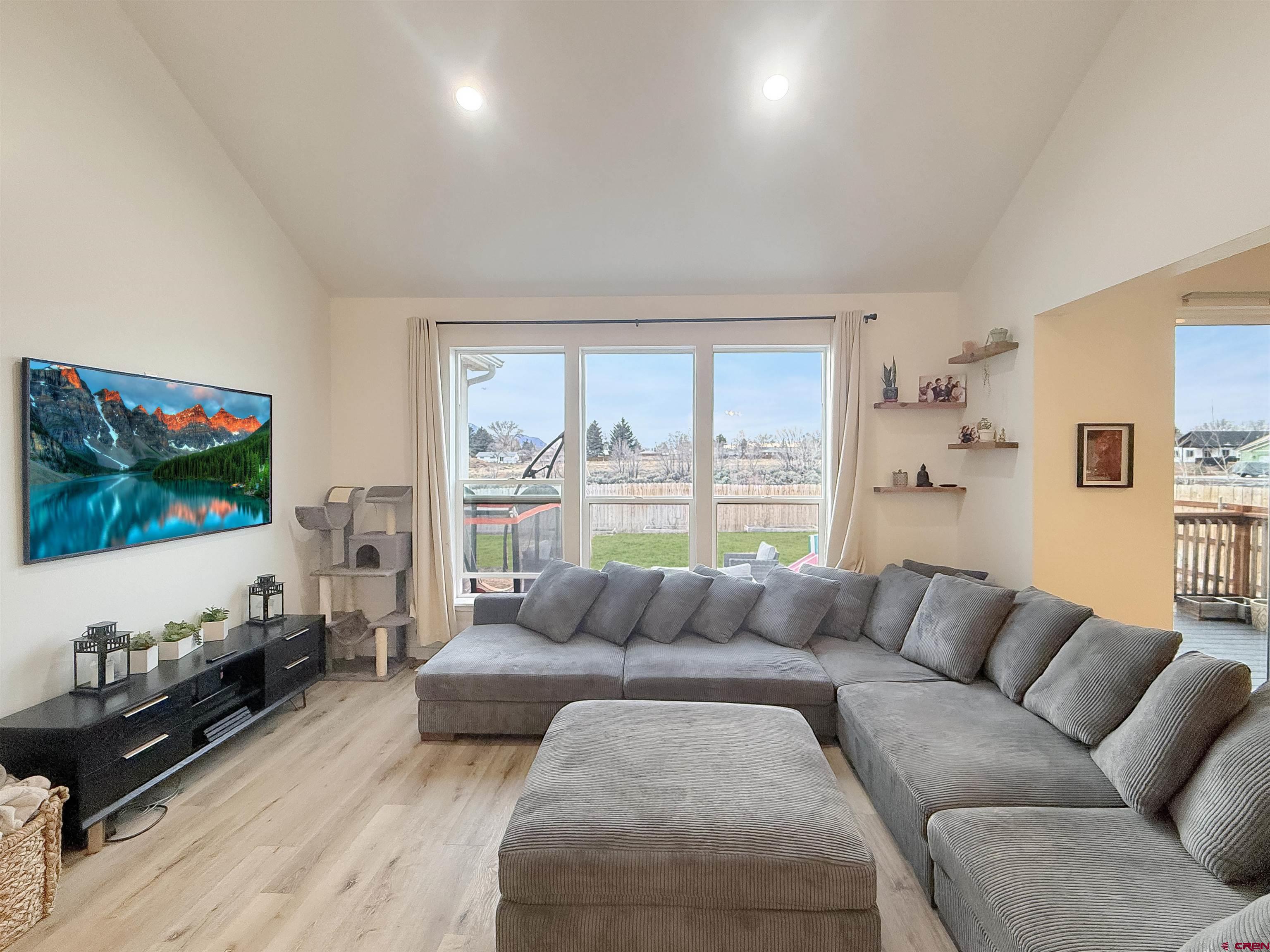 903 South Oak Street Cortez, CO 81321 - Photo 7 of 44 a living room with furniture and a flat screen tv