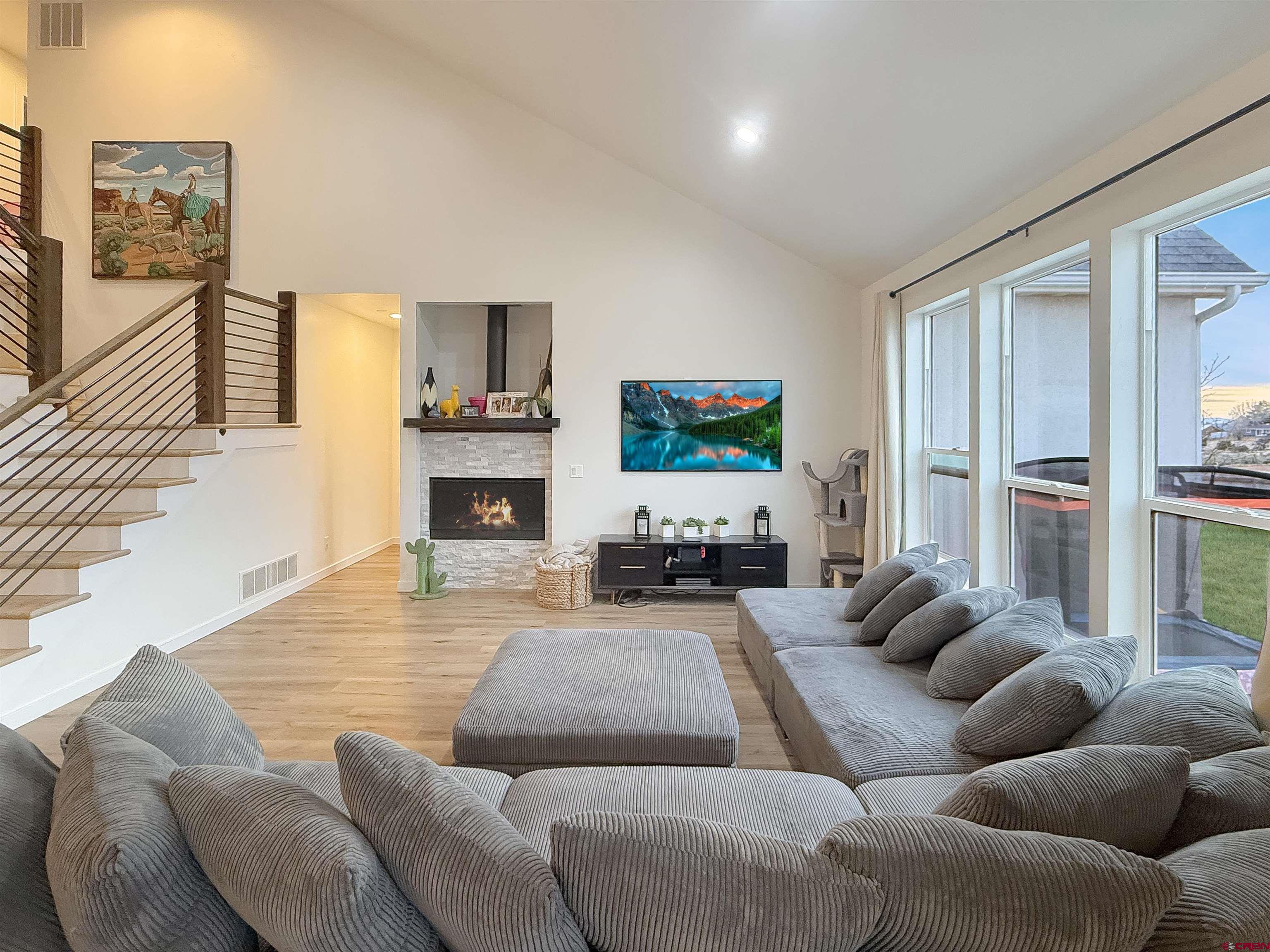 903 South Oak Street Cortez, CO 81321 - Photo 8 of 44 a living room with furniture fireplace and a flat screen tv