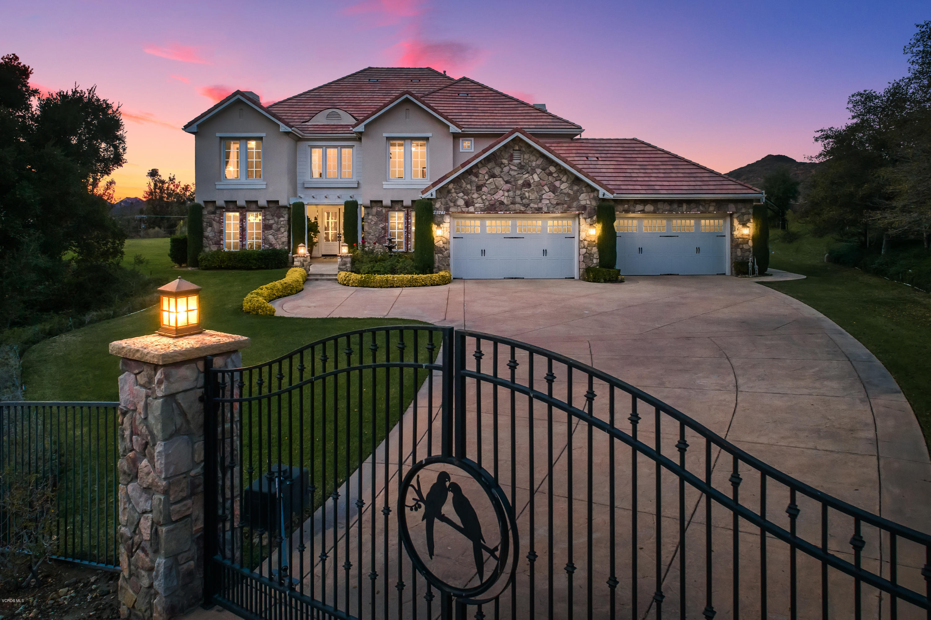 25741 Piuma Road Calabasas, CA 91302 - Photo 2 of 38 a front view of a house with a yard