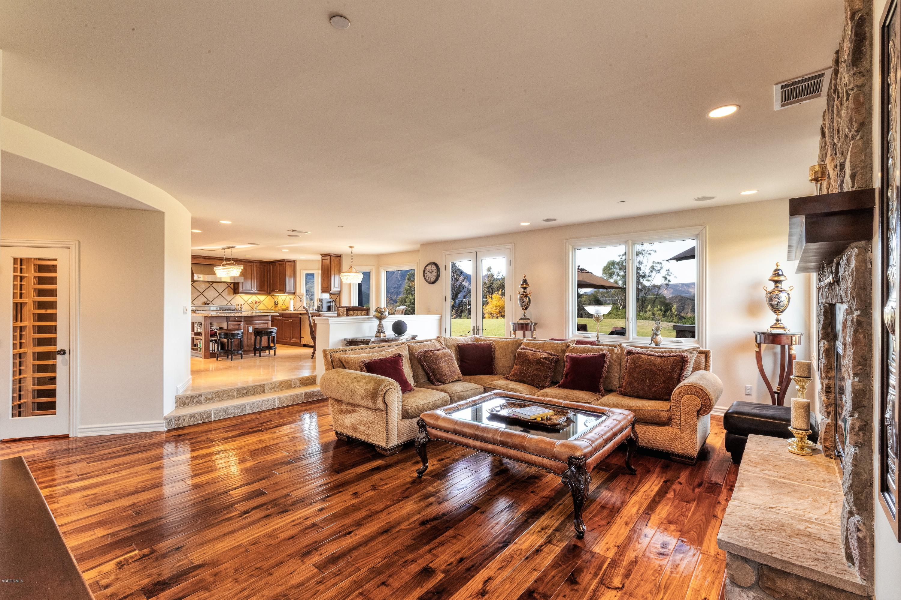 25741 Piuma Road Calabasas, CA 91302 - Photo 13 of 38 a living room with furniture and a wooden floor
