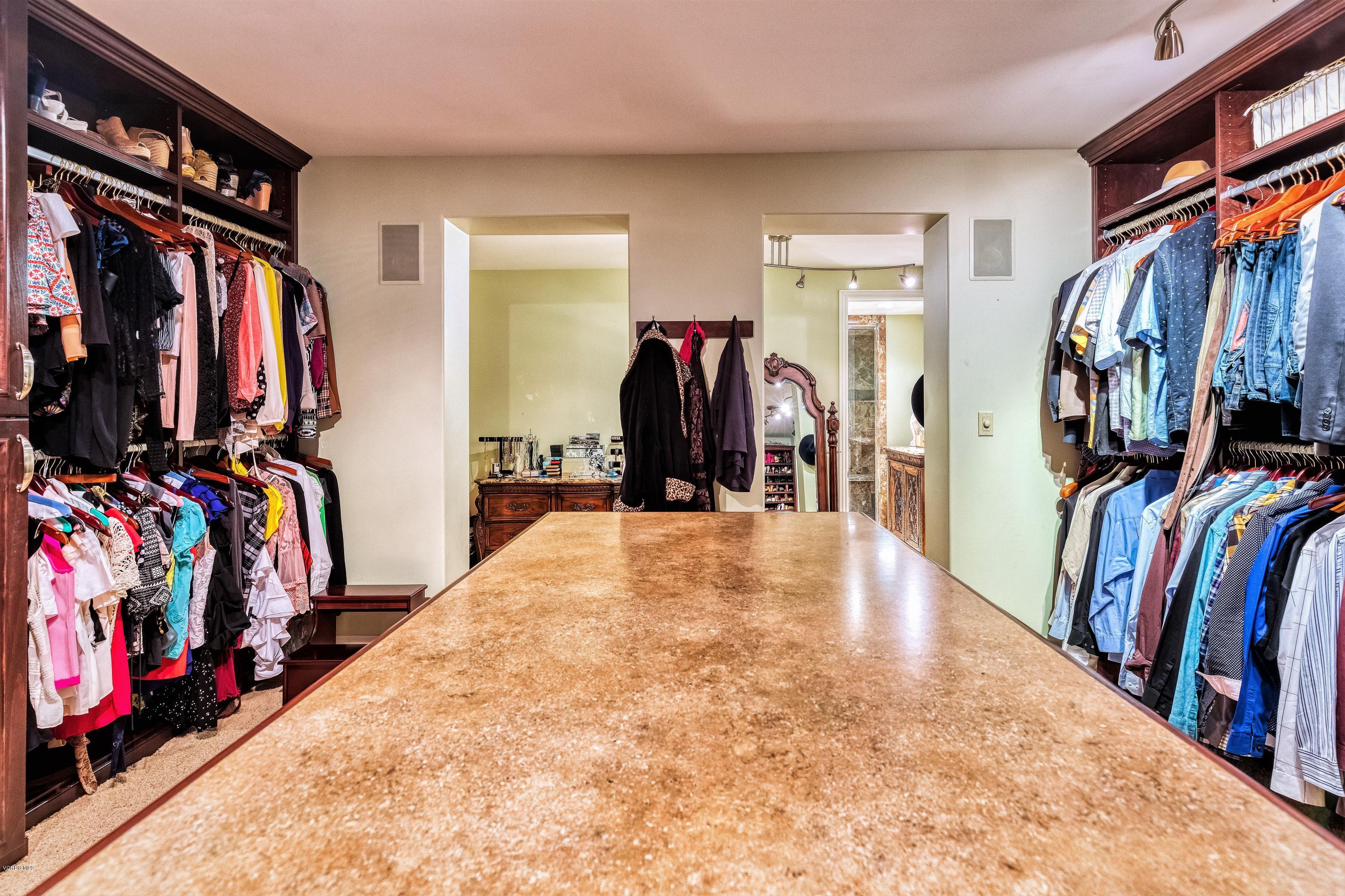 25741 Piuma Road Calabasas, CA 91302 - Photo 22 of 38 a view of walk in closet with clothes