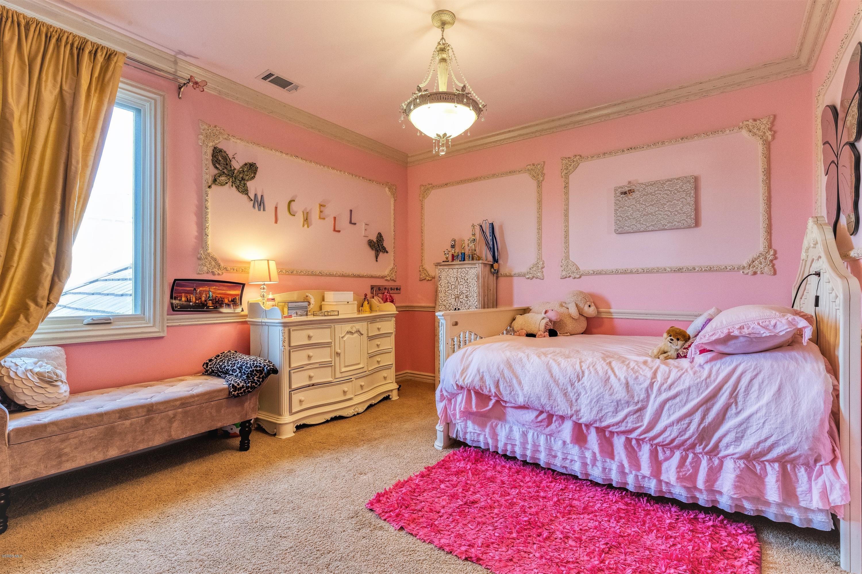 25741 Piuma Road Calabasas, CA 91302 - Photo 29 of 38 a bedroom with bed and a window