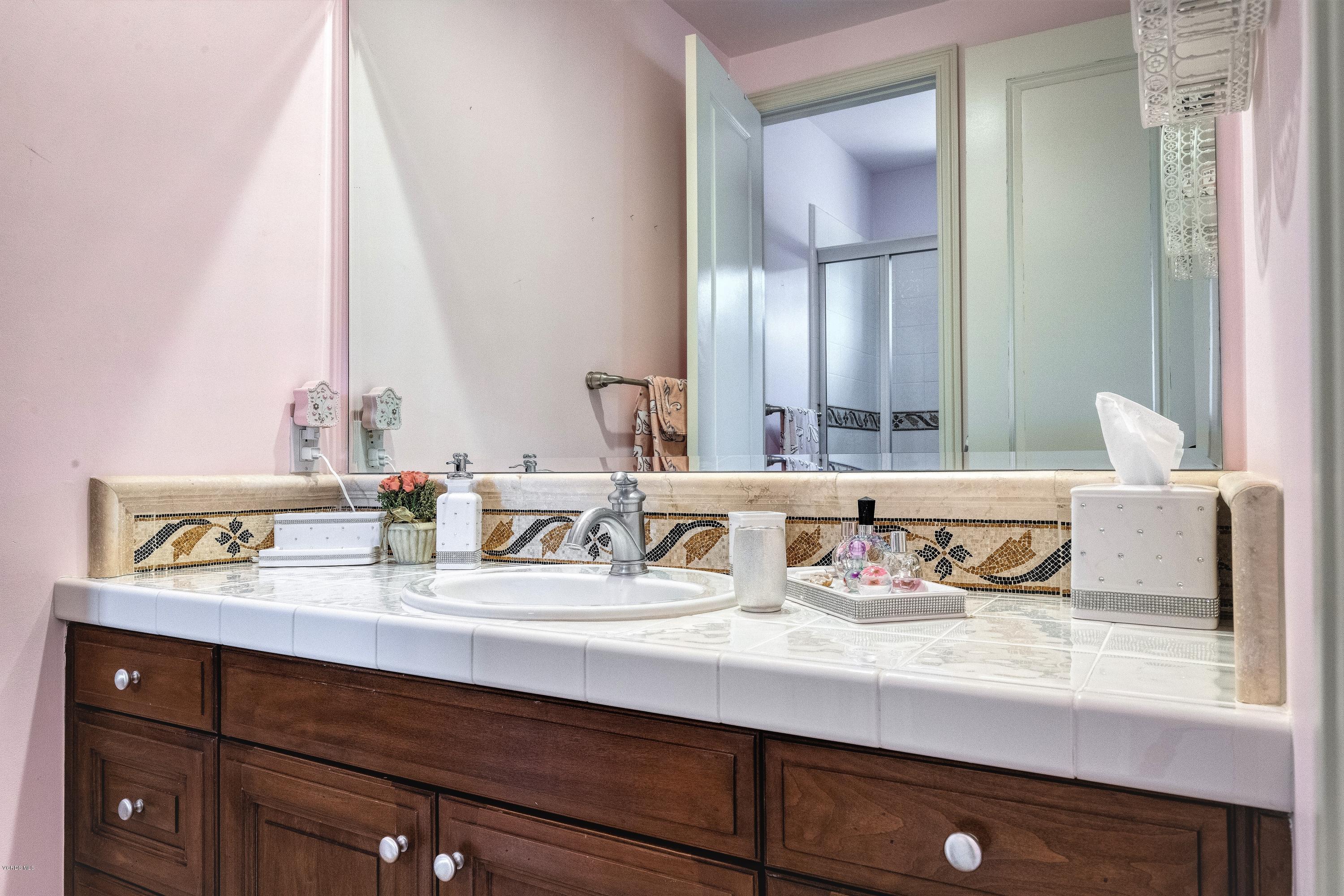 25741 Piuma Road Calabasas, CA 91302 - Photo 30 of 38 a bathroom with a sink double vanity and a mirror