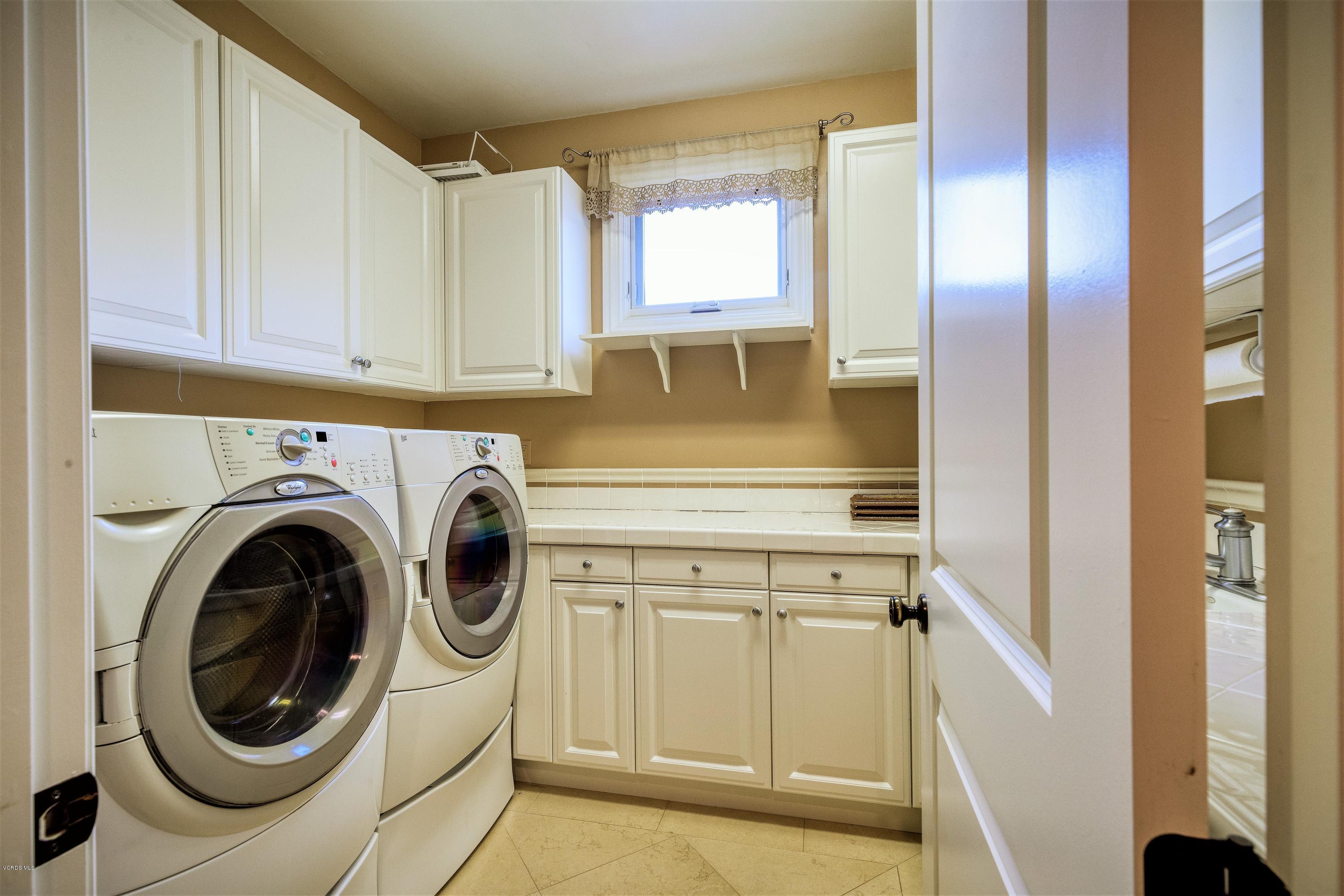 25741 Piuma Road Calabasas, CA 91302 - Photo 33 of 38 a view of a kitchen with washer and dryer