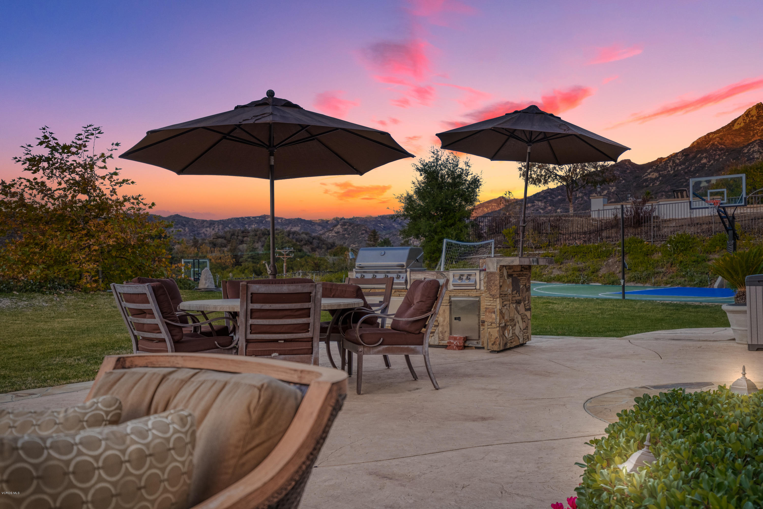 25741 Piuma Road Calabasas, CA 91302 - Photo 35 of 38 a view of a outdoor sitting area with furniture and umbrella