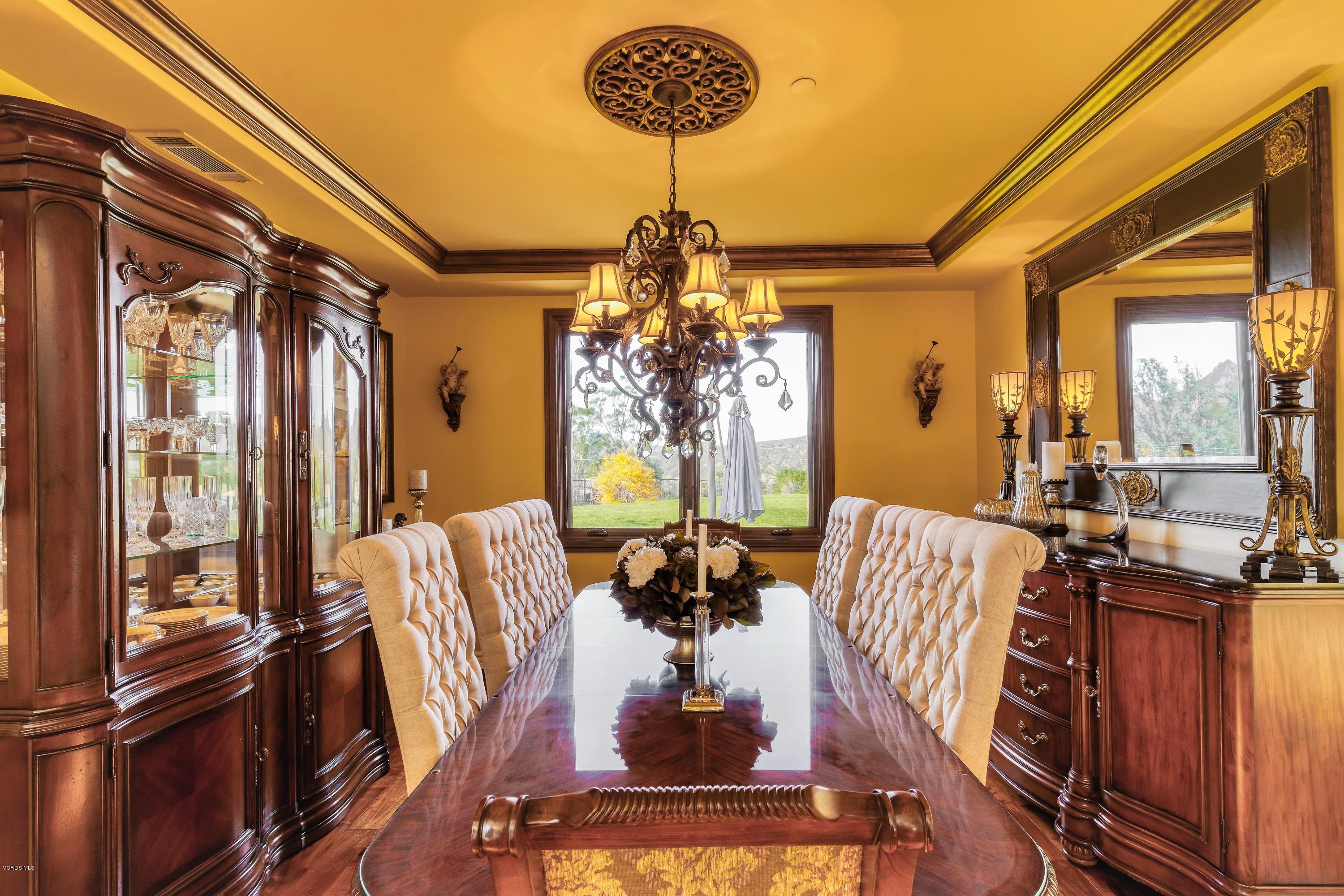 25741 Piuma Road Calabasas, CA 91302 - Photo 9 of 38 a view of a dining room with furniture and a chandelier