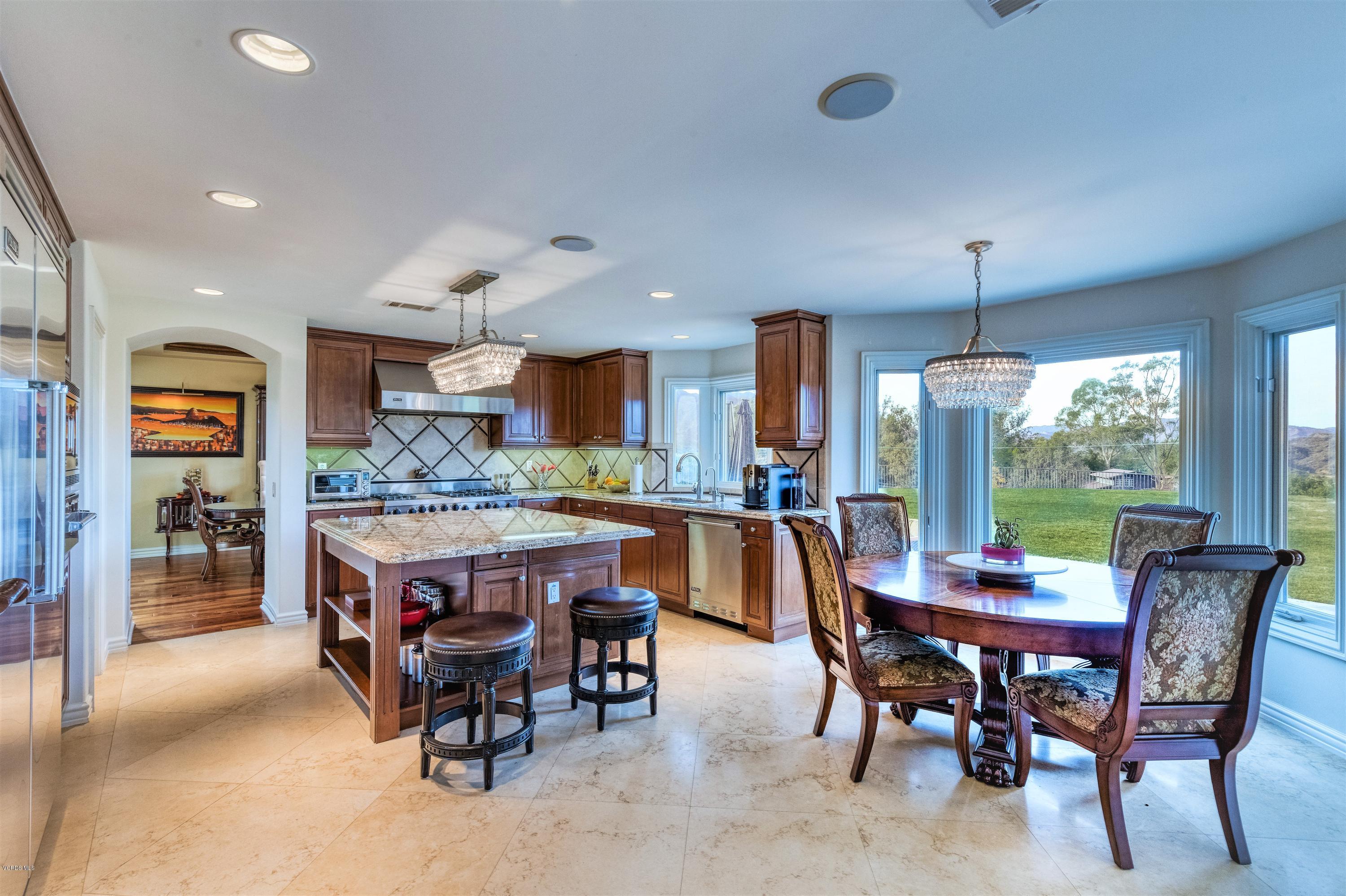 25741 Piuma Road Calabasas, CA 91302 - Photo 10 of 38 a dining area with furniture and a floor to ceiling window