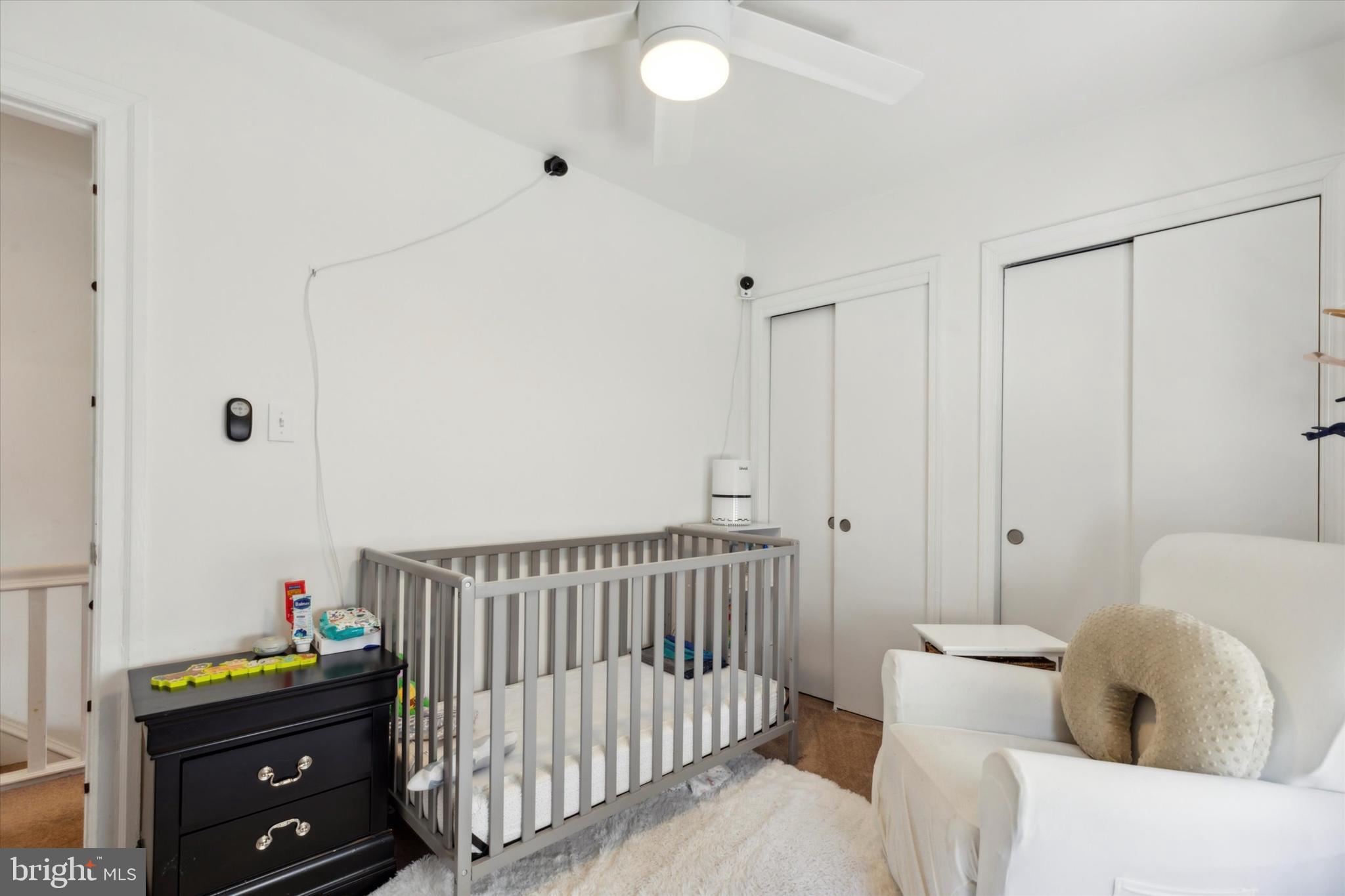 322 Woodbine Avenue Narberth, PA 19072 - Photo 17 of 26 a bedroom with furniture and a baby crib