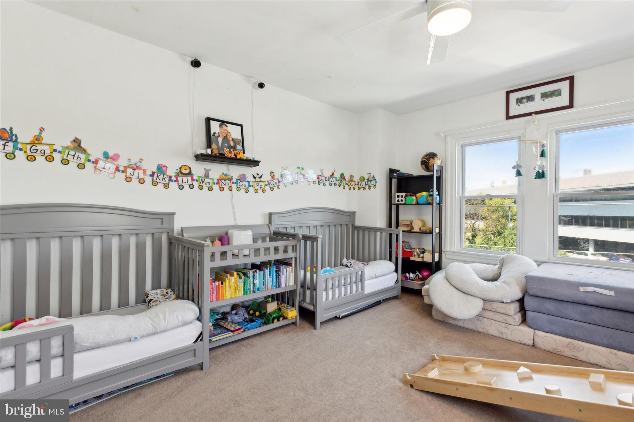 322 Woodbine Avenue Narberth, PA 19072 - Photo 20 of 26 a bedroom with furniture and a book shelf