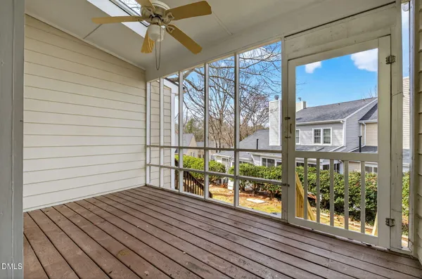 a view of a balcony with wooden floor