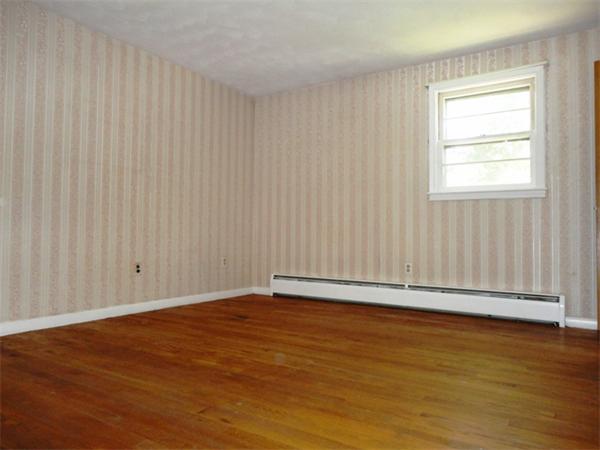 219 Forest Hills Road Springfield, MA 01128 - Photo 17 of 18 an empty room with wooden floor and windows