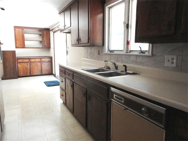 219 Forest Hills Road Springfield, MA 01128 - Photo 4 of 18 a kitchen with a sink cabinets and window