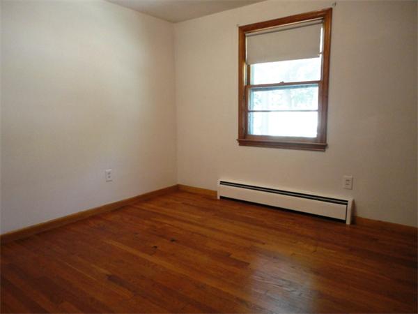 219 Forest Hills Road Springfield, MA 01128 - Photo 5 of 18 an empty room with a window