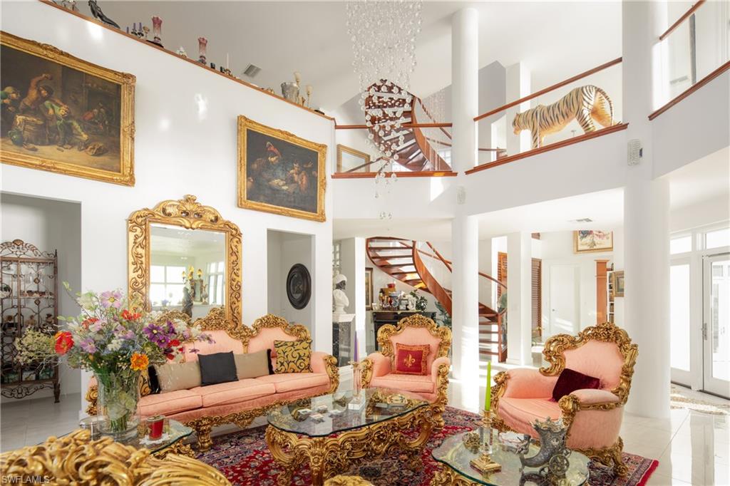 14040 Schultz Road Fort Myers, FL 33908 - Photo 20 of 48 Tiled living area featuring stairway and a high ceiling