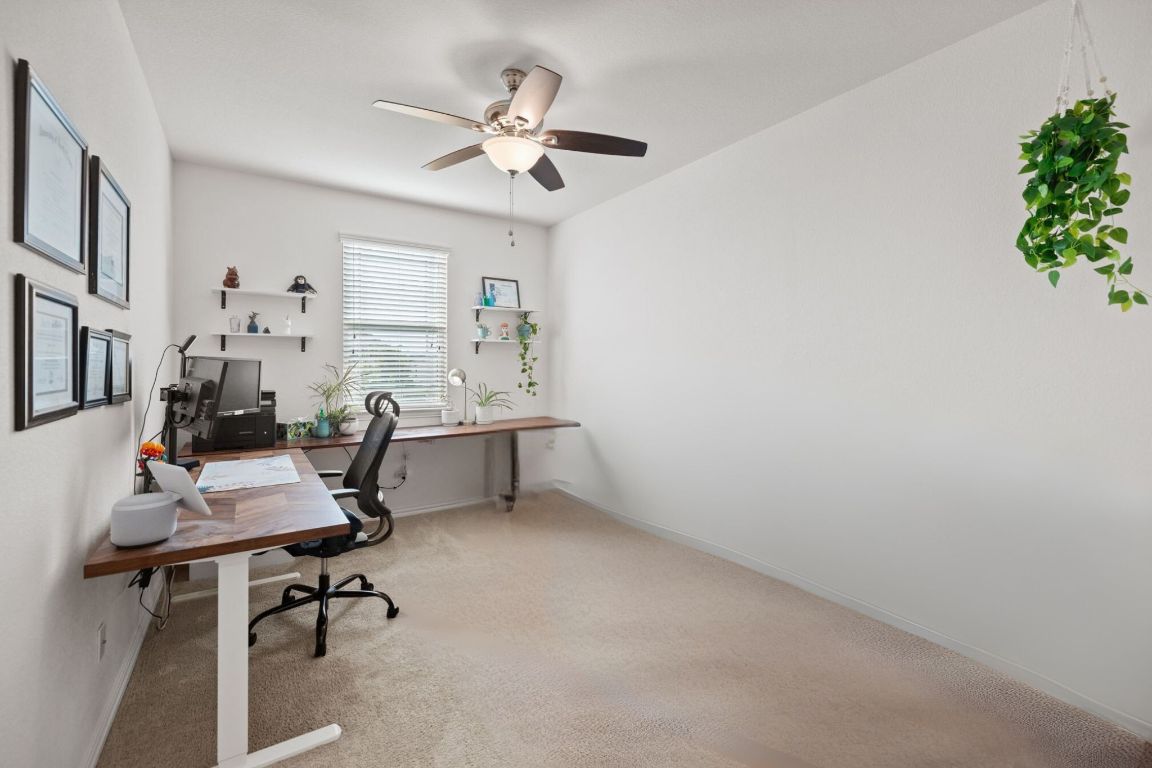 454 Shale Circle Buda, TX 78610 - Photo 16 of 27 a view of a workspace with furniture
