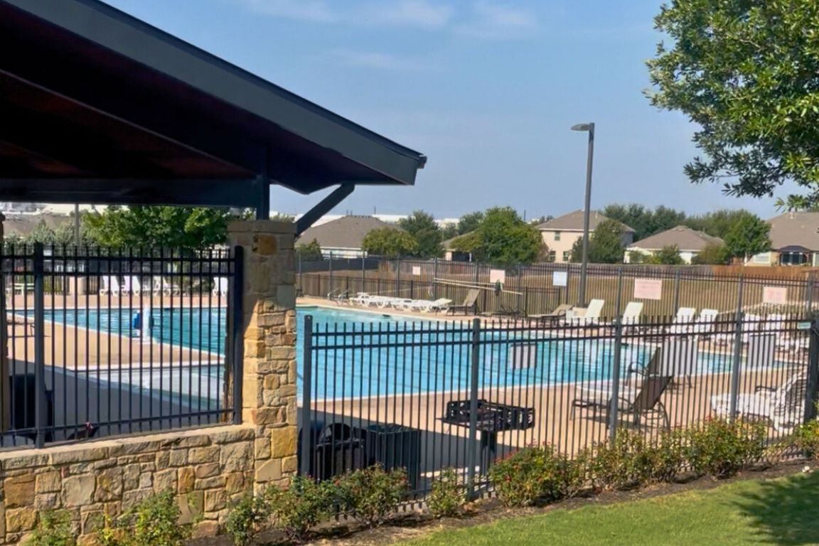 454 Shale Circle Buda, TX 78610 - Photo 25 of 27 a view of a porch with a floor to ceiling window