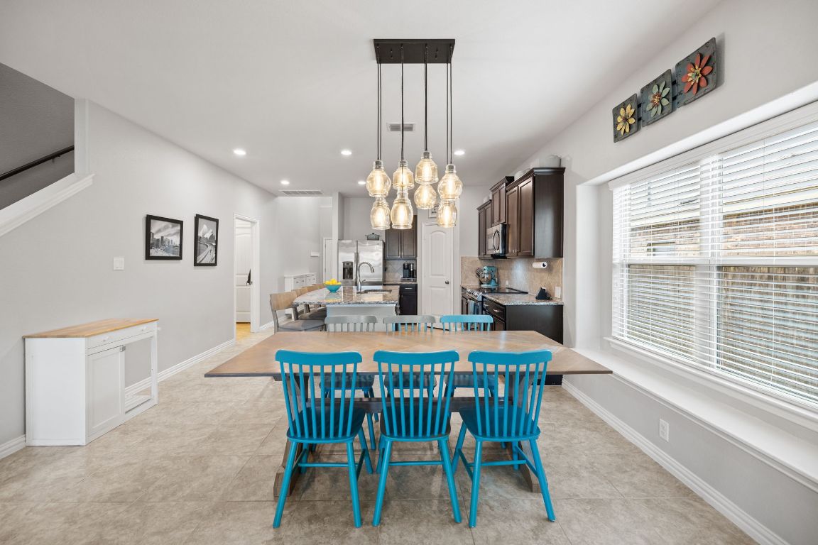 454 Shale Circle Buda, TX 78610 - Photo 5 of 27 a view of a dining room with furniture and window