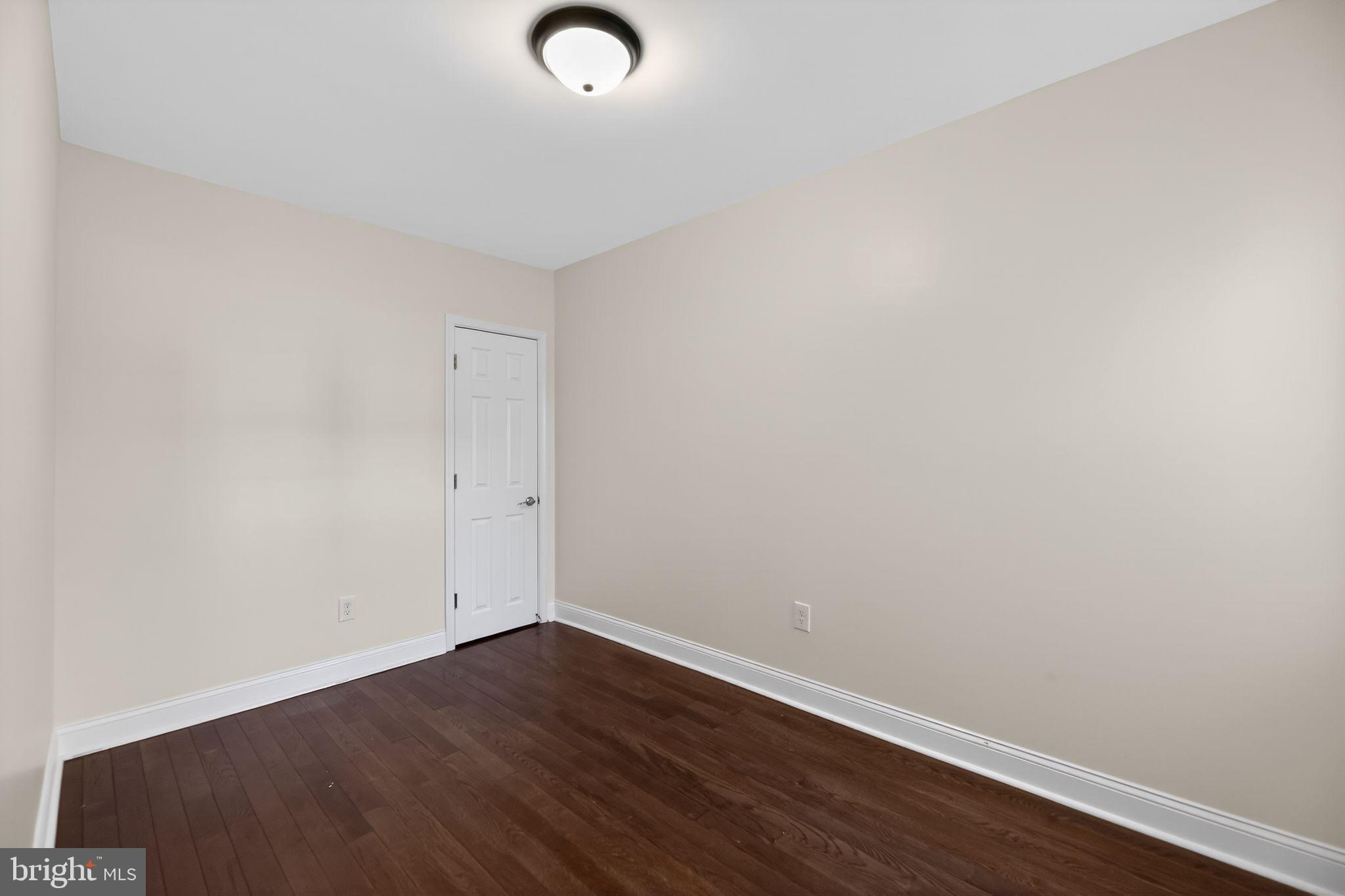 2413 North Carlisle Street Philadelphia, PA 19132 - Photo 10 of 30 an empty room with wooden floor
