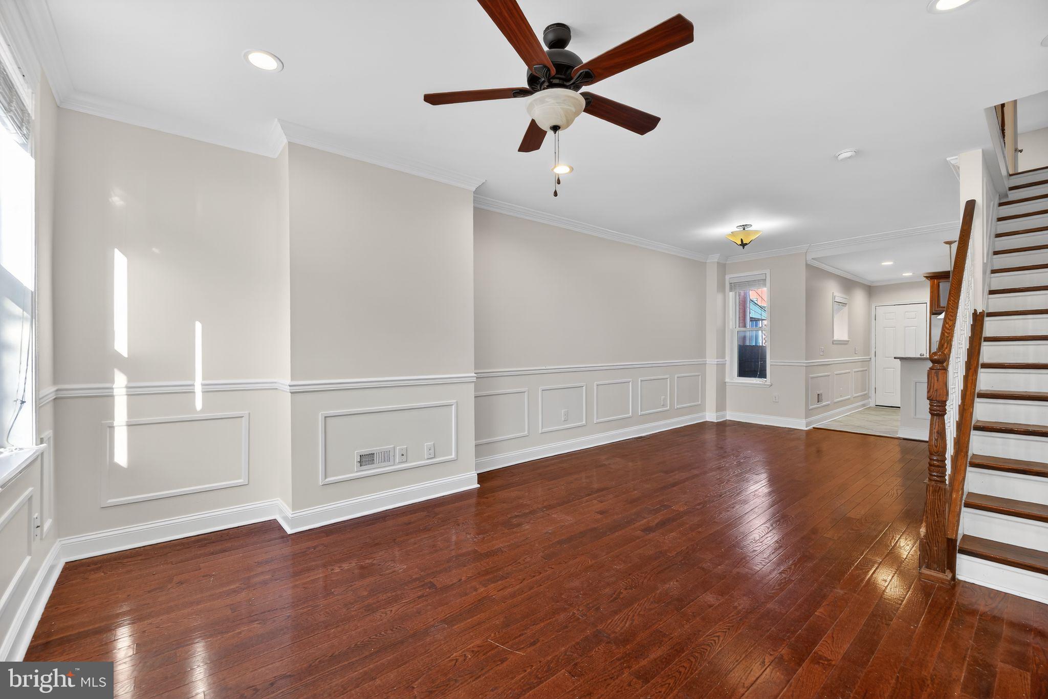 2413 North Carlisle Street Philadelphia, PA 19132 - Photo 13 of 30 a view of an empty room with wooden floor and a window