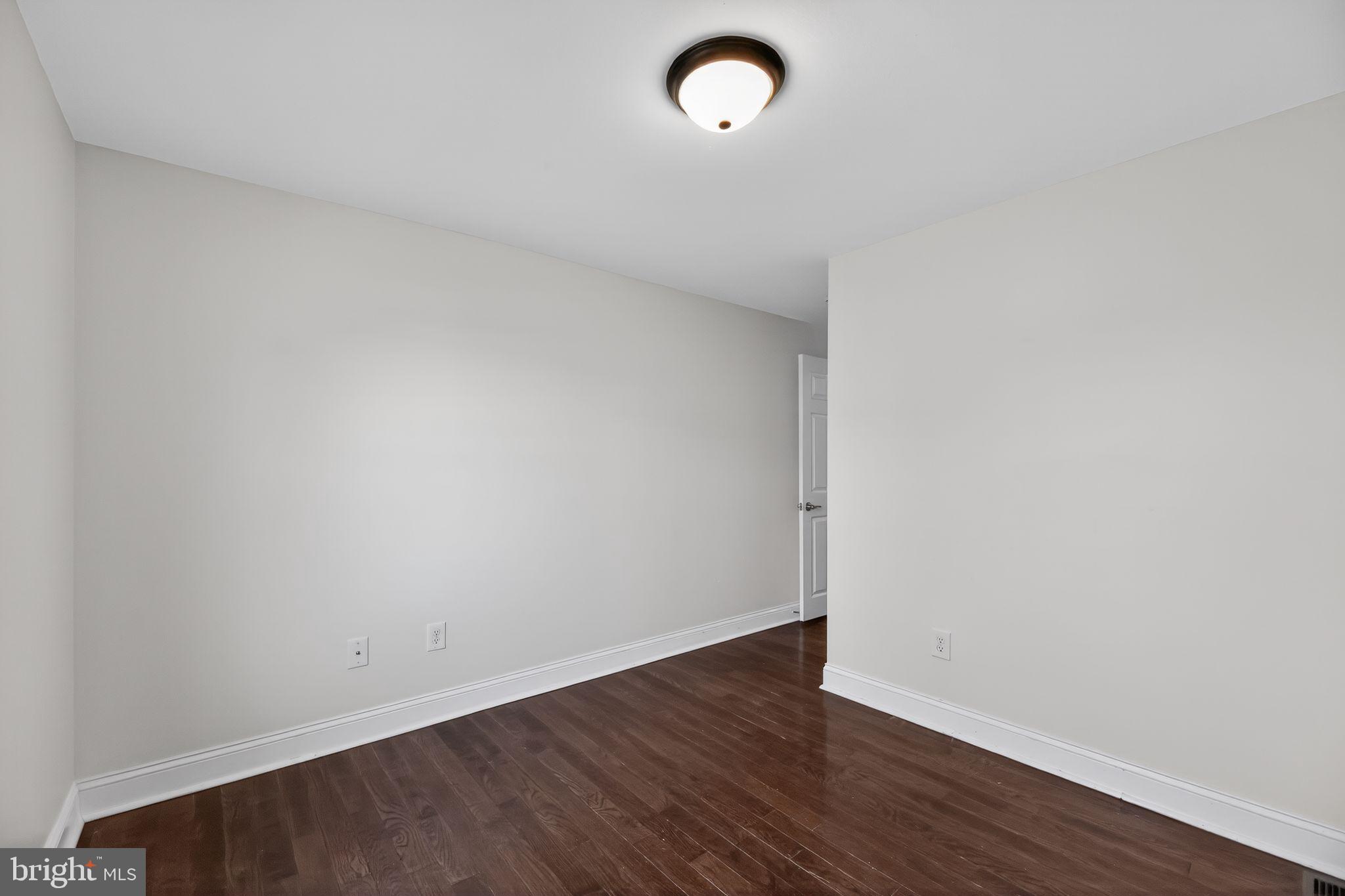 2413 North Carlisle Street Philadelphia, PA 19132 - Photo 14 of 30 a view of a room with wooden floor