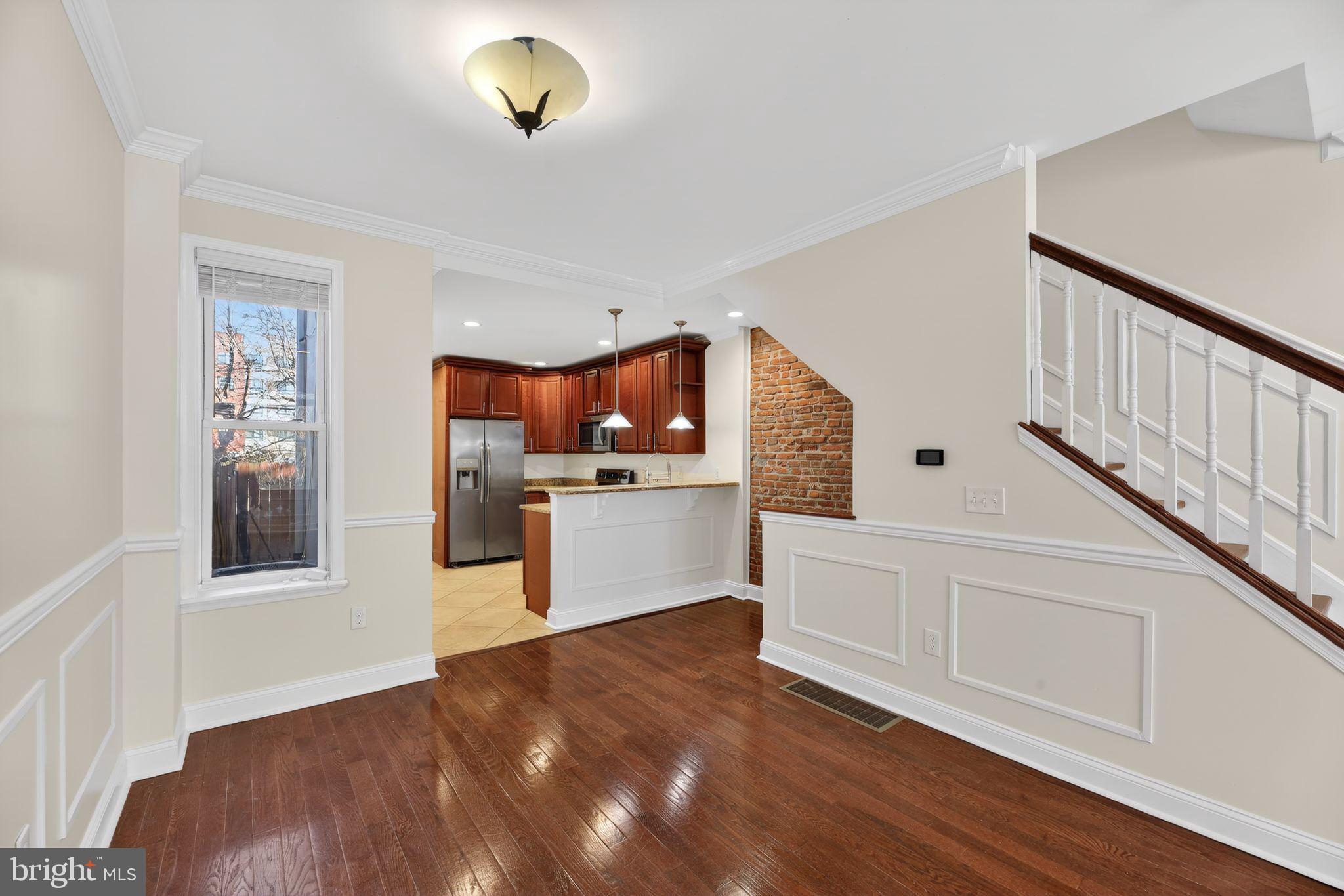 2413 North Carlisle Street Philadelphia, PA 19132 - Photo 15 of 30 a view of a kitchen with microwave and cabinets
