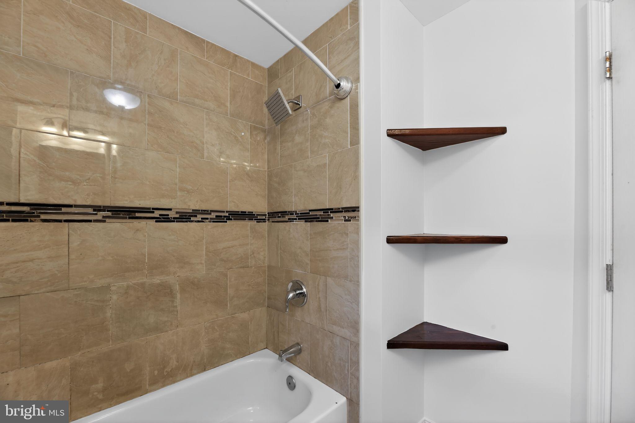 2413 North Carlisle Street Philadelphia, PA 19132 - Photo 22 of 30 a bathroom with a shower and a toilet