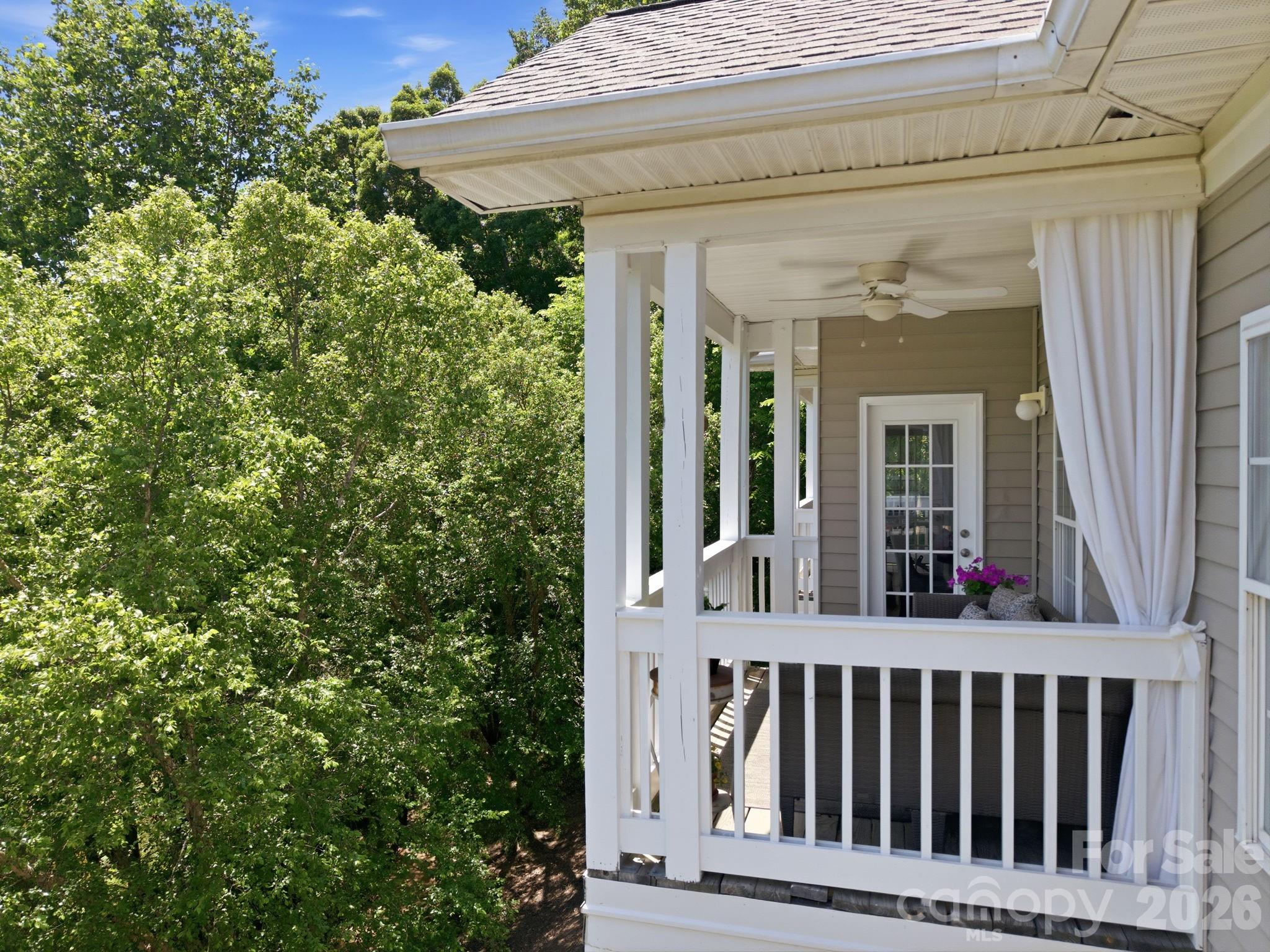8942 Rosalyn Glen Road Cornelius, NC 28031 - Photo 41 of 47 a view of a house with a porch