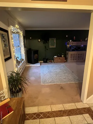 a living room with furniture and a lamp