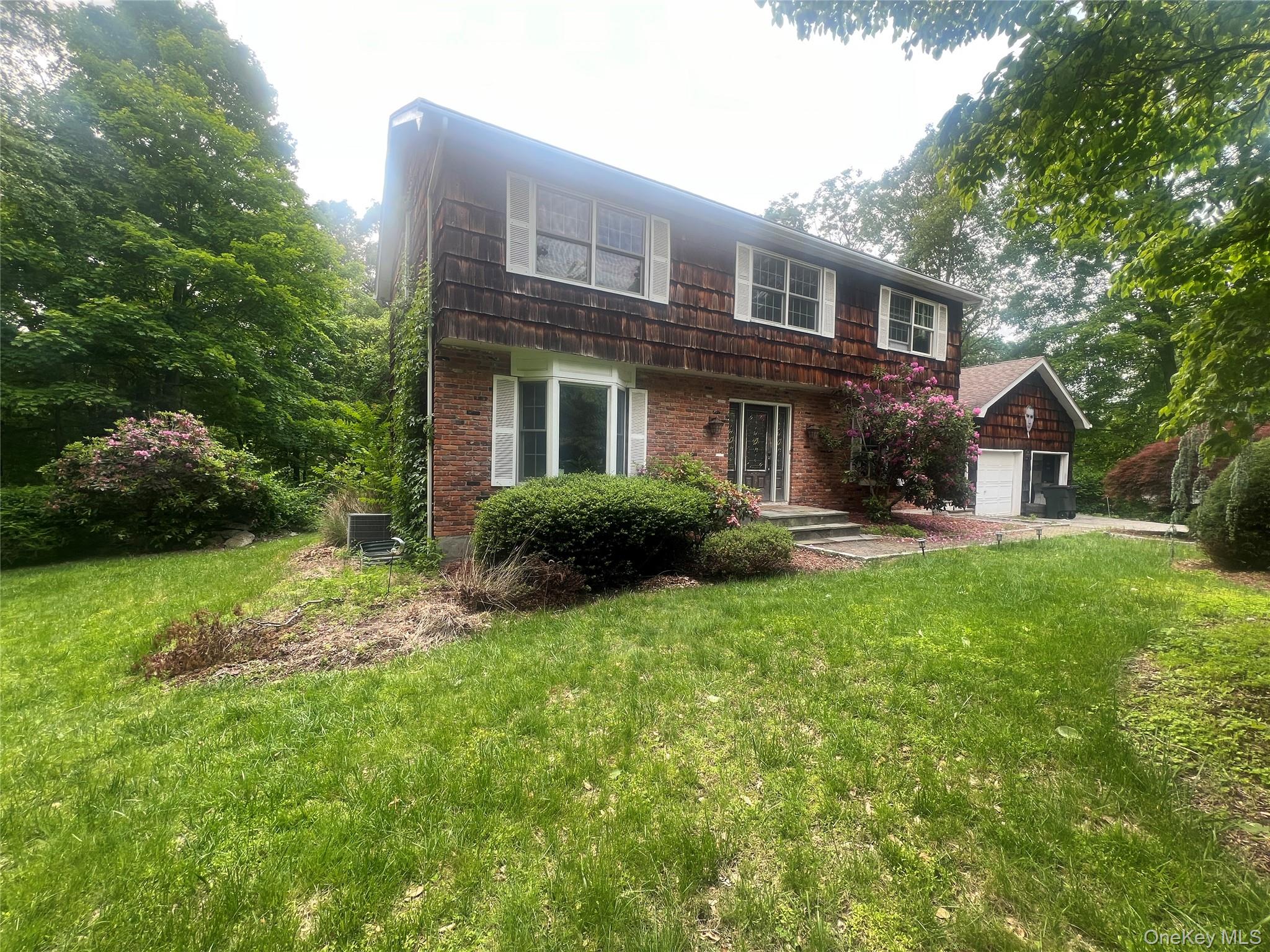 17 Birch Hill Road Putnam Valley, NY 10579 - Photo 3 of 24 a front view of a house with yard and green space